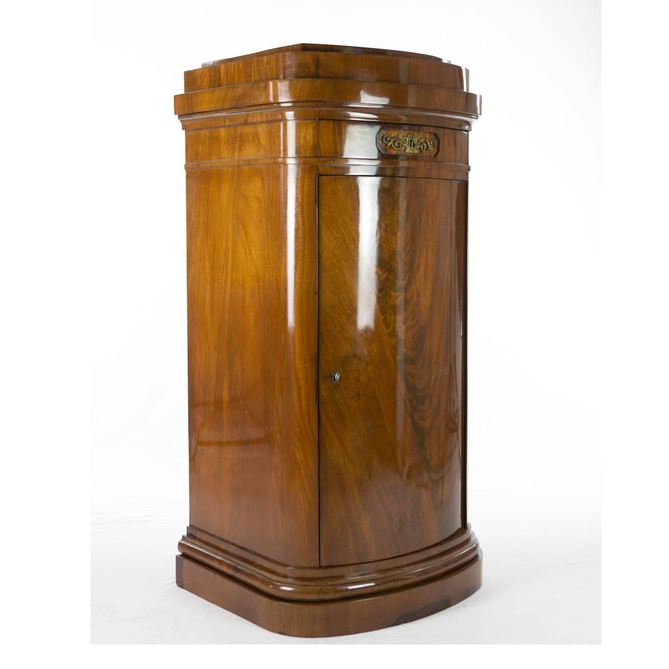 Rare Biedermeier pillar cupboard, probably Berlin, 1820-1830, rounded front, mahogany veneered, drawer and single-door, restored condition, shellac polished surface.