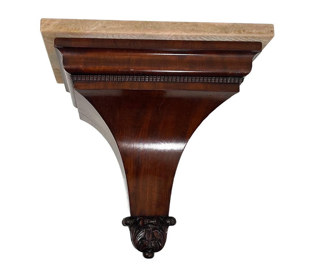 19th Century Biedermeier mahogany wall console bracket

A mahogany wall console bracket with marble top. A sleek model with an acathus leaf motif at the tip. Dutch Biedermeier, Mid-19th Century. 

The measurement is 35 cm high, 34 cm wide and