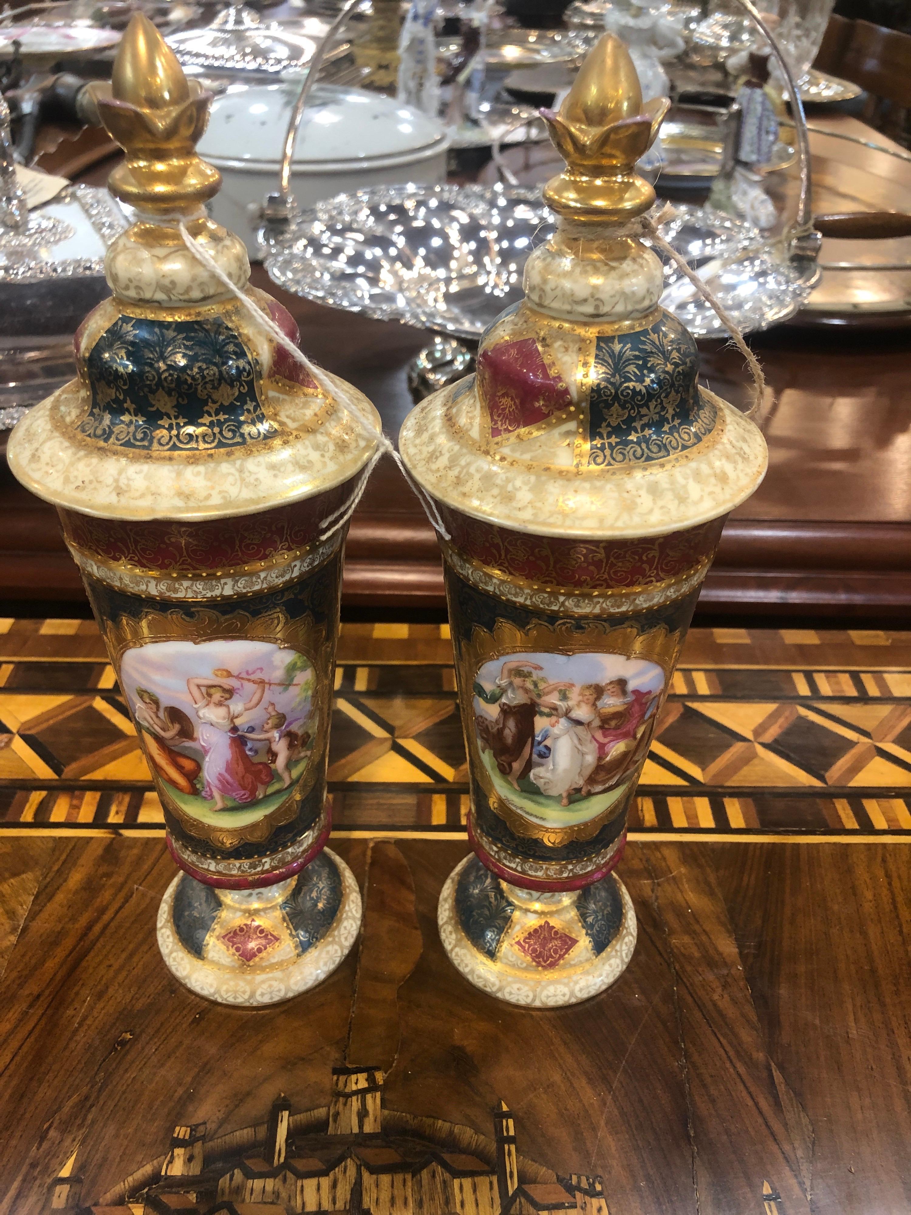 Pair of vases by Royal Vienna, painted and gilded, vases of well-proportioned and of excellent workmanship, in excellent state of preservation, circa 1870.