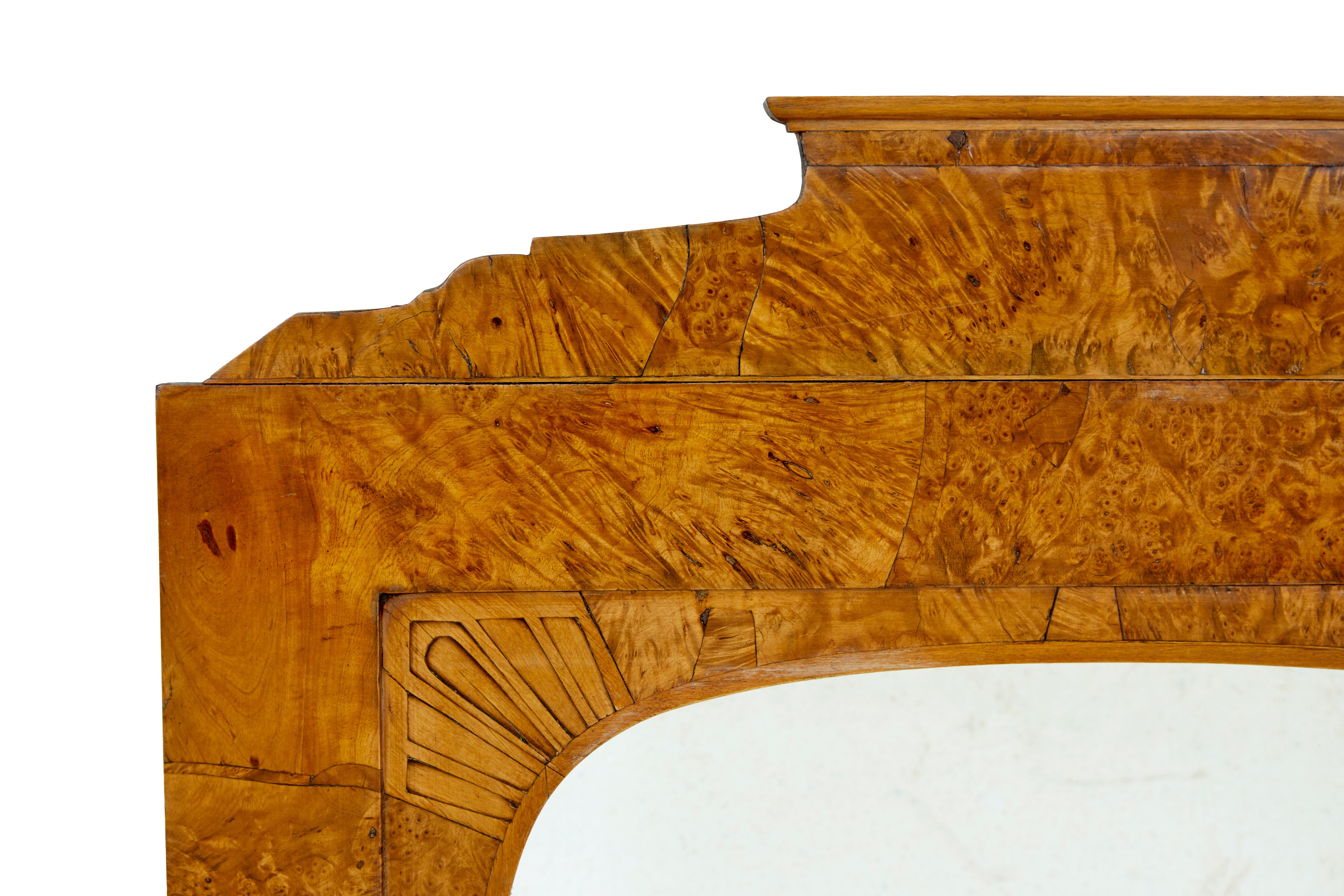19th century Biedermeier root birch mantle mirror circa 1830.

Made with quality burr birch. Shaped architectural top, inlaid fans to the inner edge. Ideal size for multi rooms such as bedrooms and cloak rooms.

Good color and patina.

Minor surface