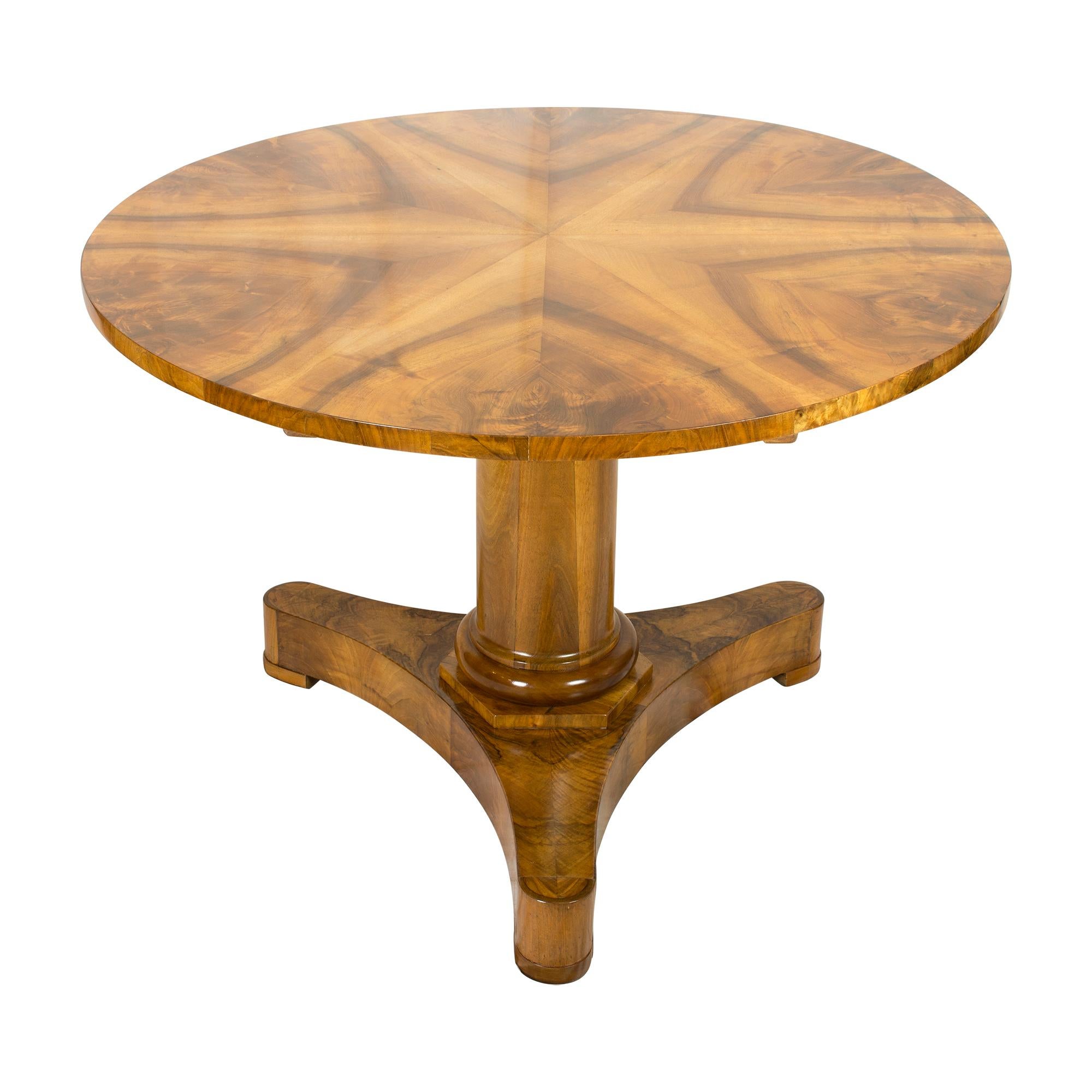 Introducing the Biedermeier round table, made with Walnut veneer on a solid spruce wood base. This table features a simple yet elegant design and is perfect for intimate dinner parties or business meetings. The round shape provides ample space for