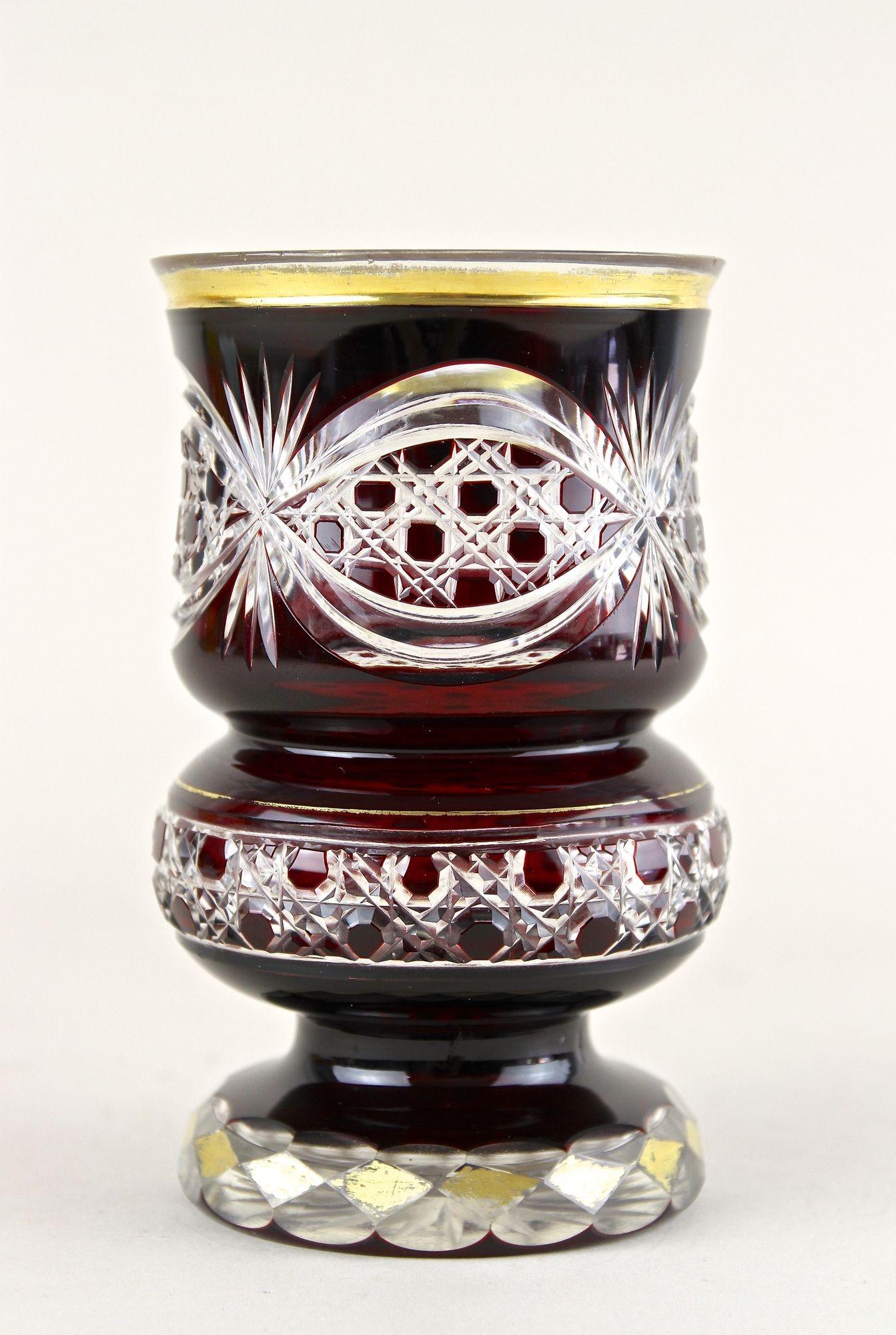 Exceptional mid 19th Century ruby red glass goblin from the famous Biedermeier period in Bohemia (Czech Republic). Elaborately made of overlayed ruby glass around 1840, this unusual late Biedermeier glass goblin impresses with its extraordinary