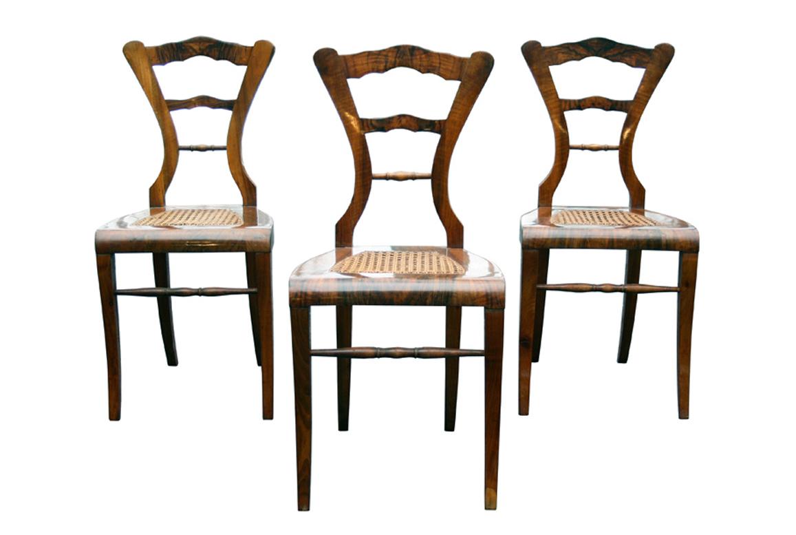Hello,
This fine walnut Viennese Biedermeier chairs were made circa 1825-30.

Viennese Biedermeier is distinguished by their sophisticated proportions, rare and refined design and excellent craftsmanship and continue to have a great influence on