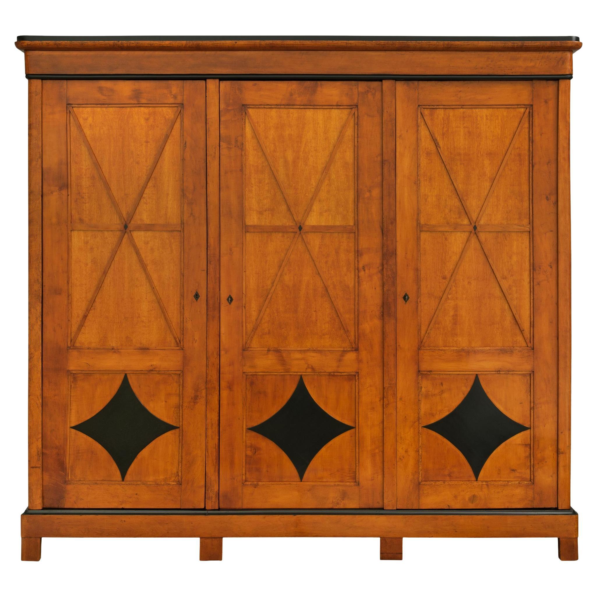 19th century Biedermeier st. Maple and ebonized Fruitwood armoire For Sale