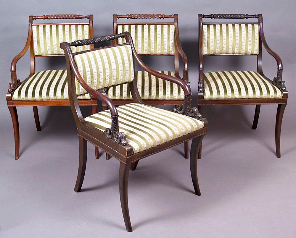 19th century Biedermeier style mahogany armchairs set of four
A set of four Biedermeier-style armchairs, with a contoured frame, with an upholstered seat and backrest, supported by four saber-like legs. Curved handrails, carved at the bottom in the