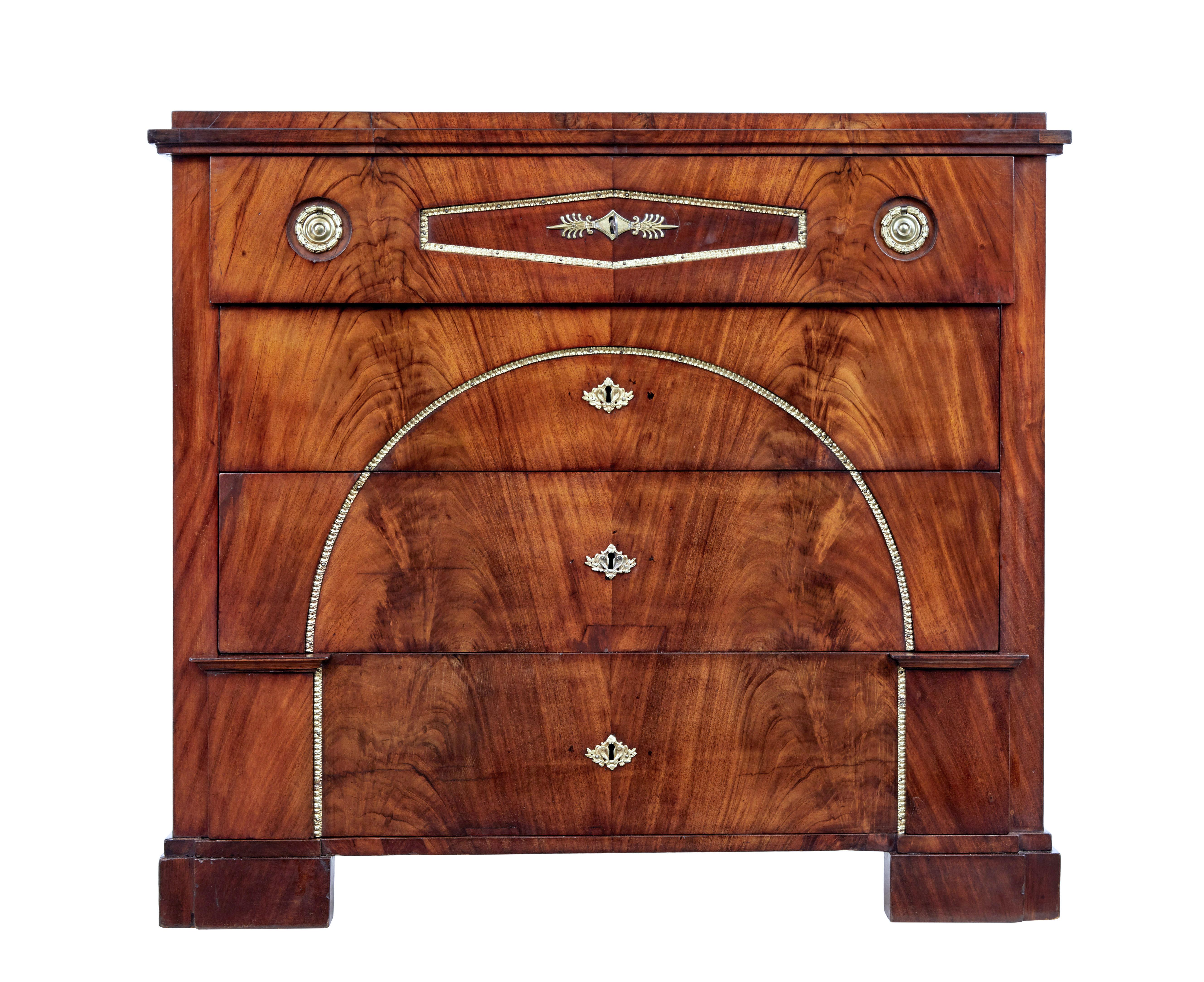 Biedermeier period swedish mahogany secretaire chest of drawers, circa 1810.

Stunning secretaire chest in rich mahogany. 4 drawer chest with architectural elements to the bottom drawer.

Top drawer pulls out and lowers to create a small writing