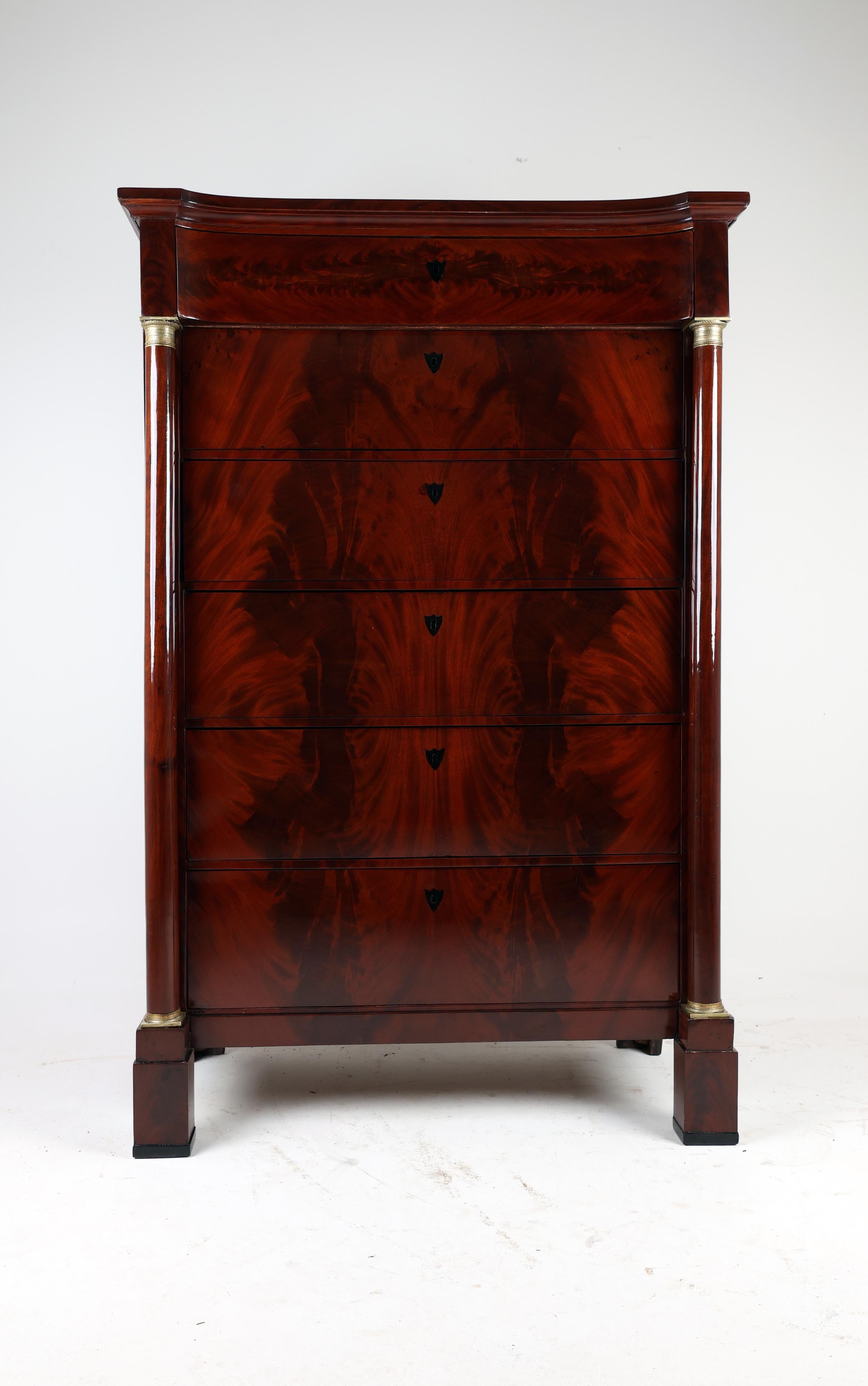 19th Century Biedermeier Tall Chest of Drawers,
1825-1830, Northern Germany
Mahogany

,,The Biedermeier period was an era in Central Europe between 1815 and 1848 during which the middle classes grew in number and the arts began to appeal to their
