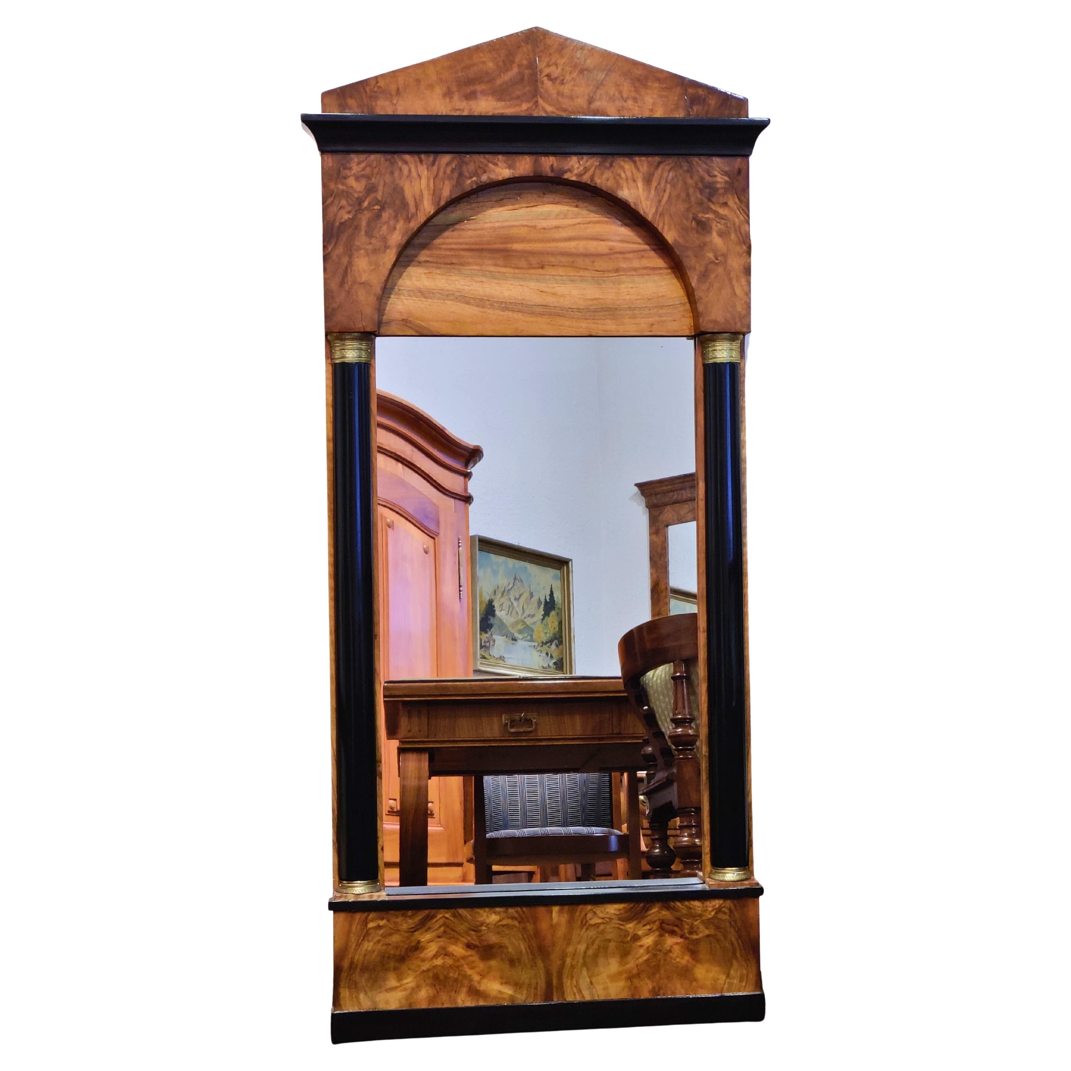19th Century, Biedermeier Wall Mirror in Walnut with Ebonized Columns For Sale