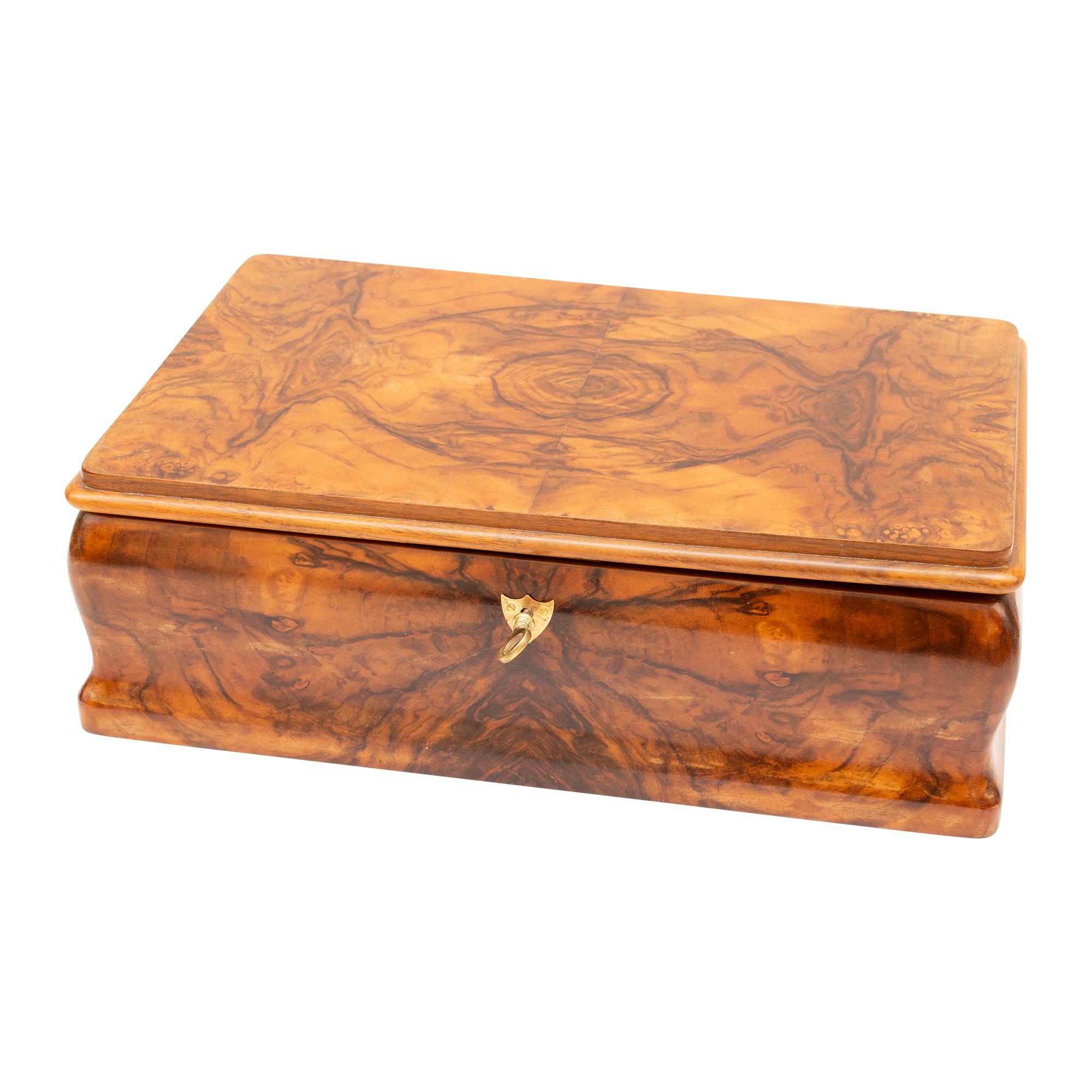 This stunning Biedermeier casket is crafted from walnut veneer on a spruce body, with a removable oak partition and a maple veneer interior. It has been expertly restored and hand-polished to an impeccable finish, and the lock is fully functional.