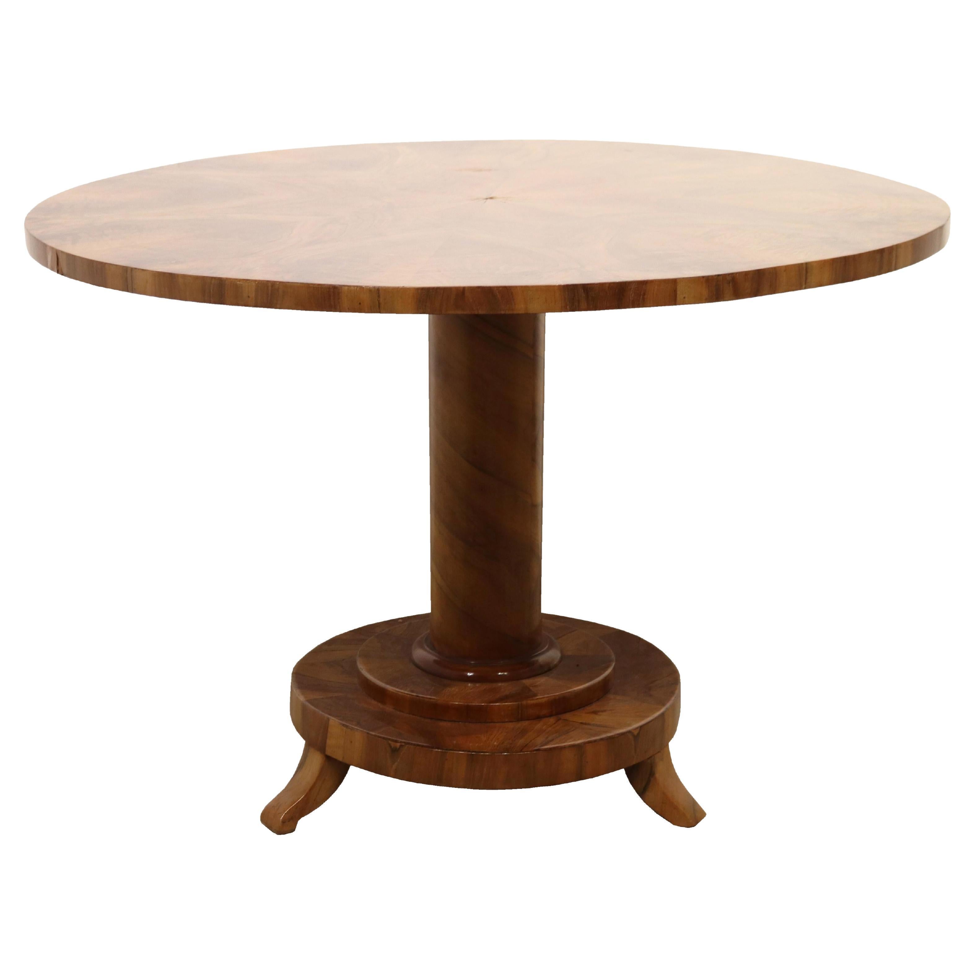 Hello,
This exceptional large Biedermeier salon walnut pedestal table was made in Vienna, c. 1825.

Viennese Biedermeier is distinguished by their sophisticated proportions, rare and refined design and excellent craftsmanship and continue to have a