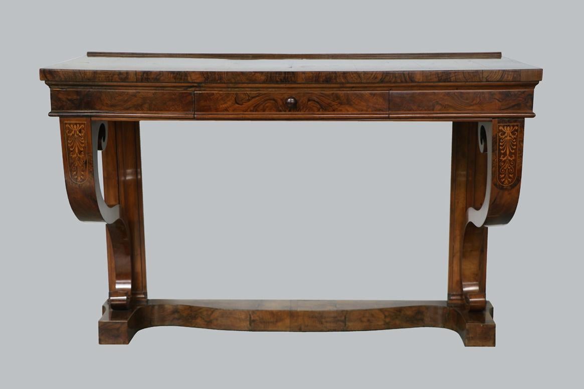 Hello,
This exceptional, large walnut Biedermeier console is the best example of top-quality Viennese piece from circa 1820-25.

Viennese Biedermeier is distinguished by their sophisticated proportions, rare and refined design and excellent