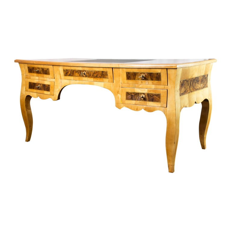 Very beautiful desk. The desk is from the Biedermeier period and was covered with cherry veneer with walnut & walnut root wood. The desk is very well suited to be placed in the middle of the room, as the back is also veneered. The front of the desk