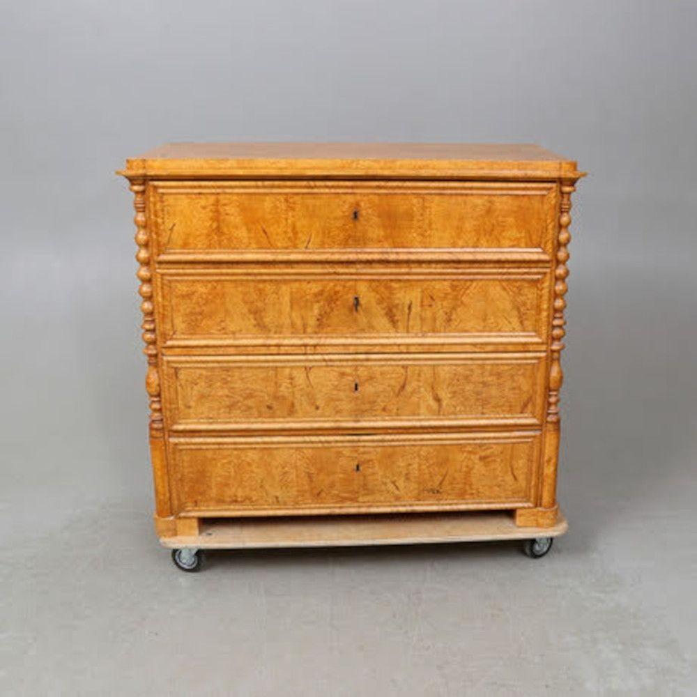 19th century birch burl wood chest of drawers with carved spindle details, circa 1840. Rounded pilasters, luminous birch burl veneer with fabulous grain pattern, four spacious drawers, turned carved spindle details on either side of dresser, and