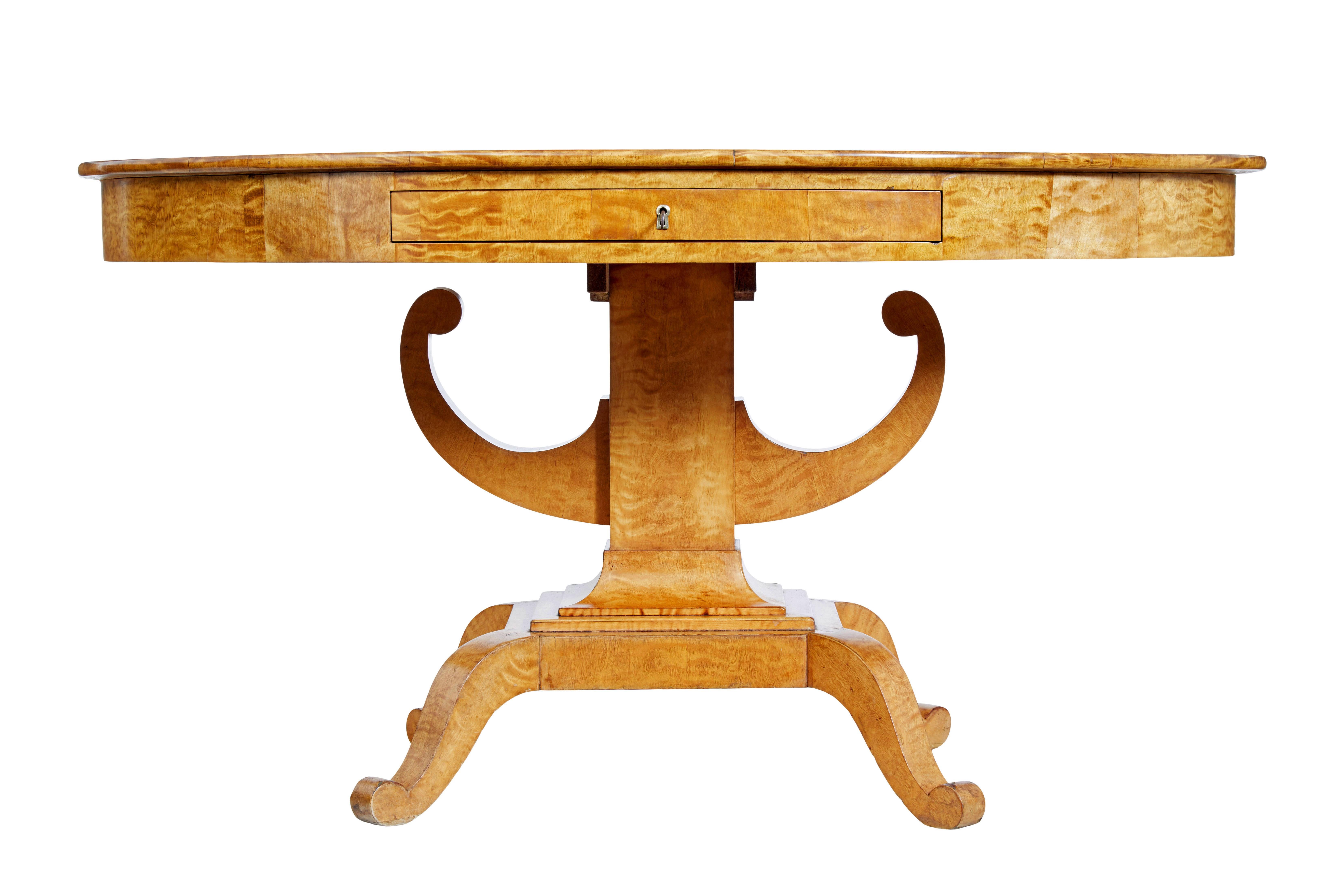 Oval 19th century birch empire center table circa 1860

Beautiful swedish birch center table.  Oval top surface with matched birch veneers and striking grain.  Deep freize with single drawer to the front.  Supported by a block base and scroll