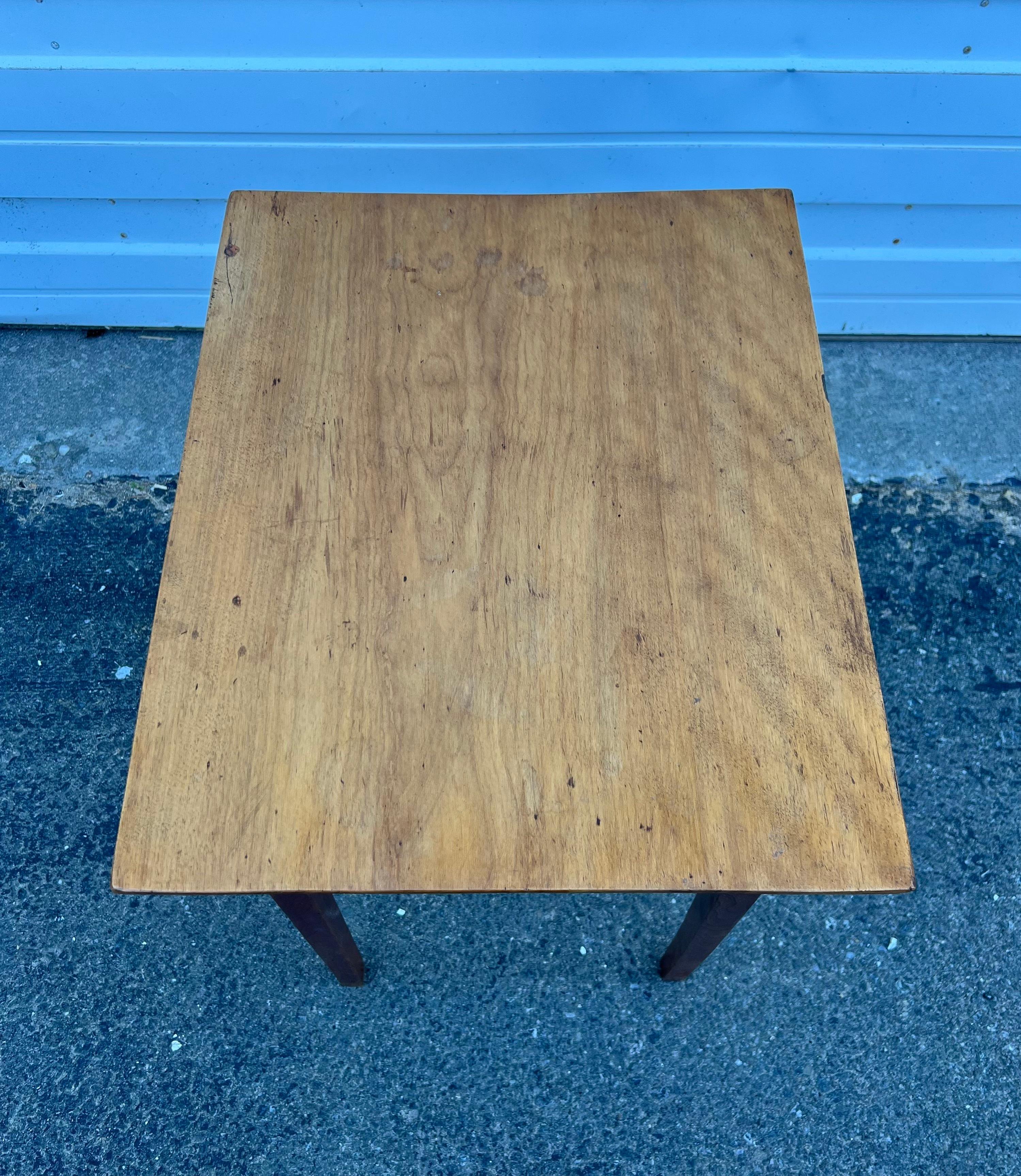 Diminutive 19th century Birch stand with single board top, one drawer with central brass pull, and tapered legs.  Very pretty, vibrant wood.