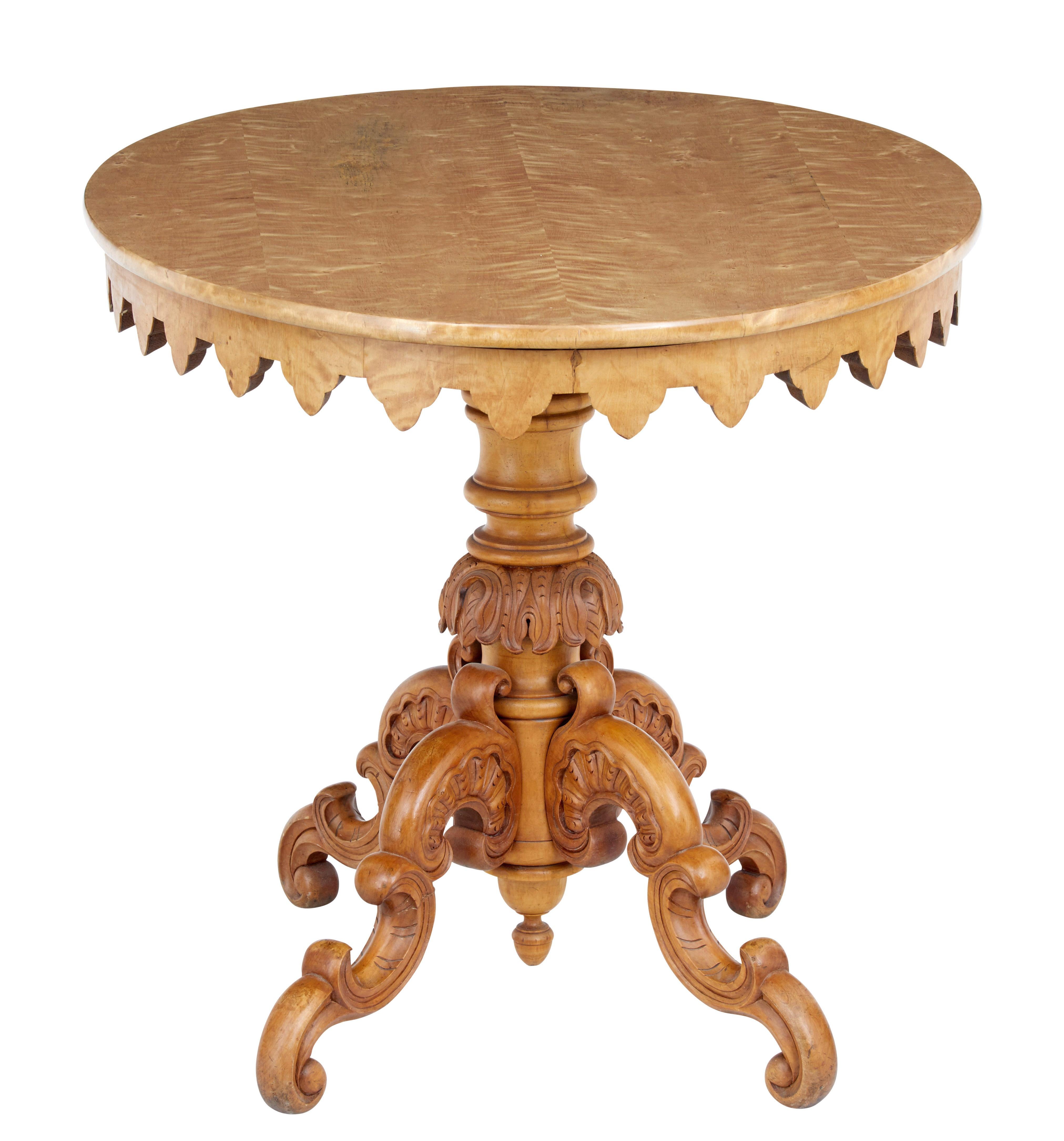 Swedish birch oval center table, circa 1880.

Veneered oval top with shaped Gothic style frieze below the top surface. Standing on a heavily carved and turned base and 4 scrolling legs.

Wear to veneer on top surface which has been polished