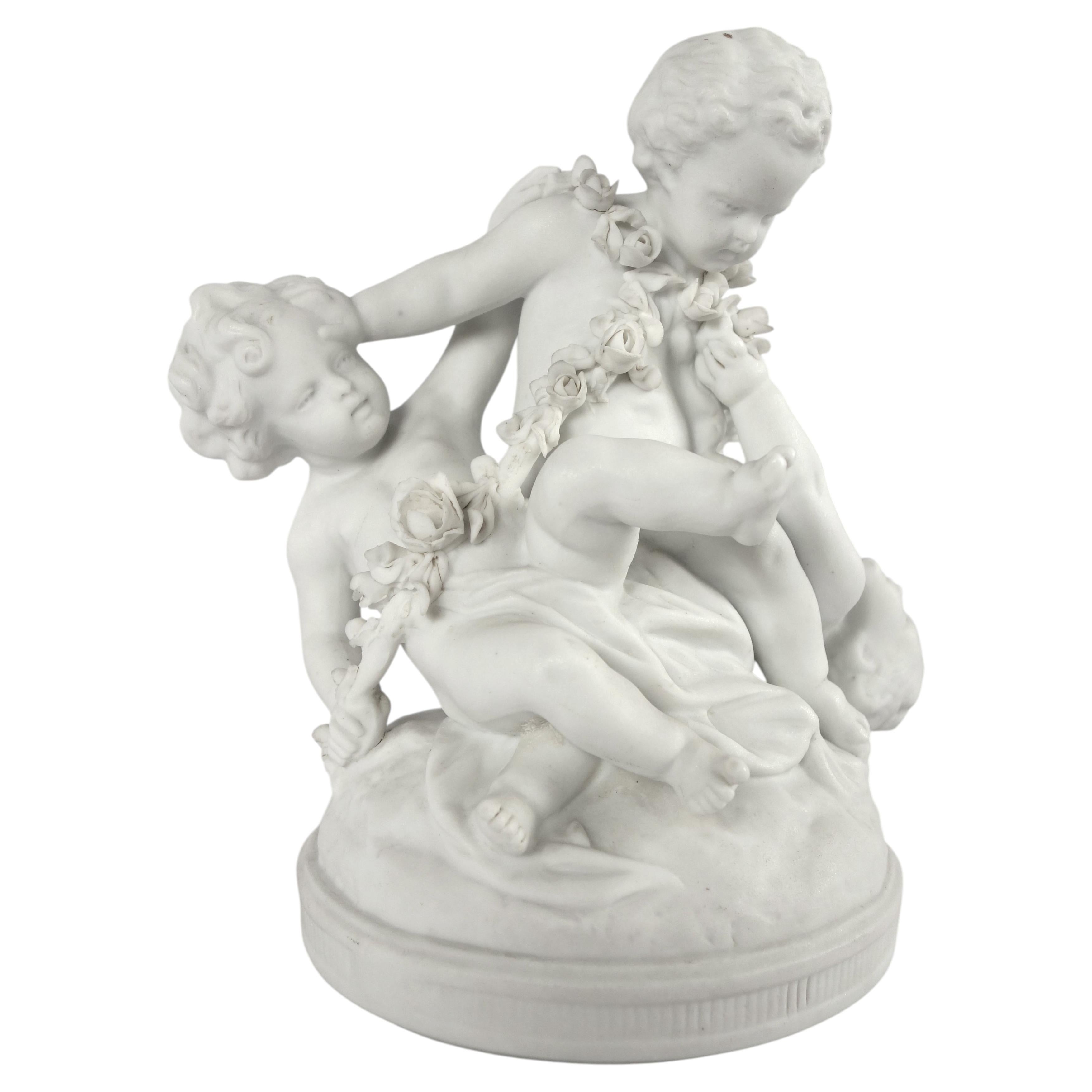 19th century biscuit group of three putti playing - 19th century