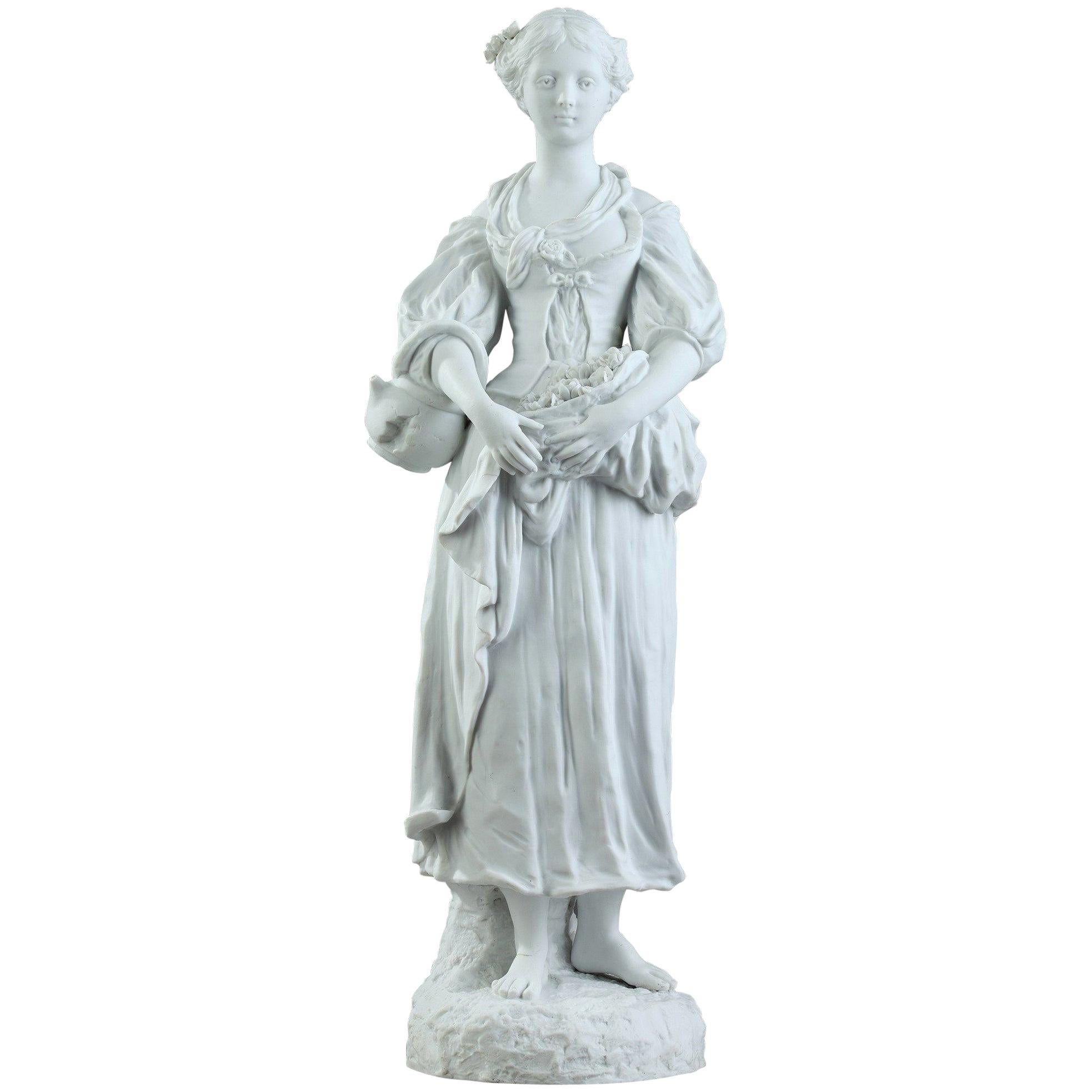 Statuette de jeune femme en biscuit avec fleurs, XIXe siècle