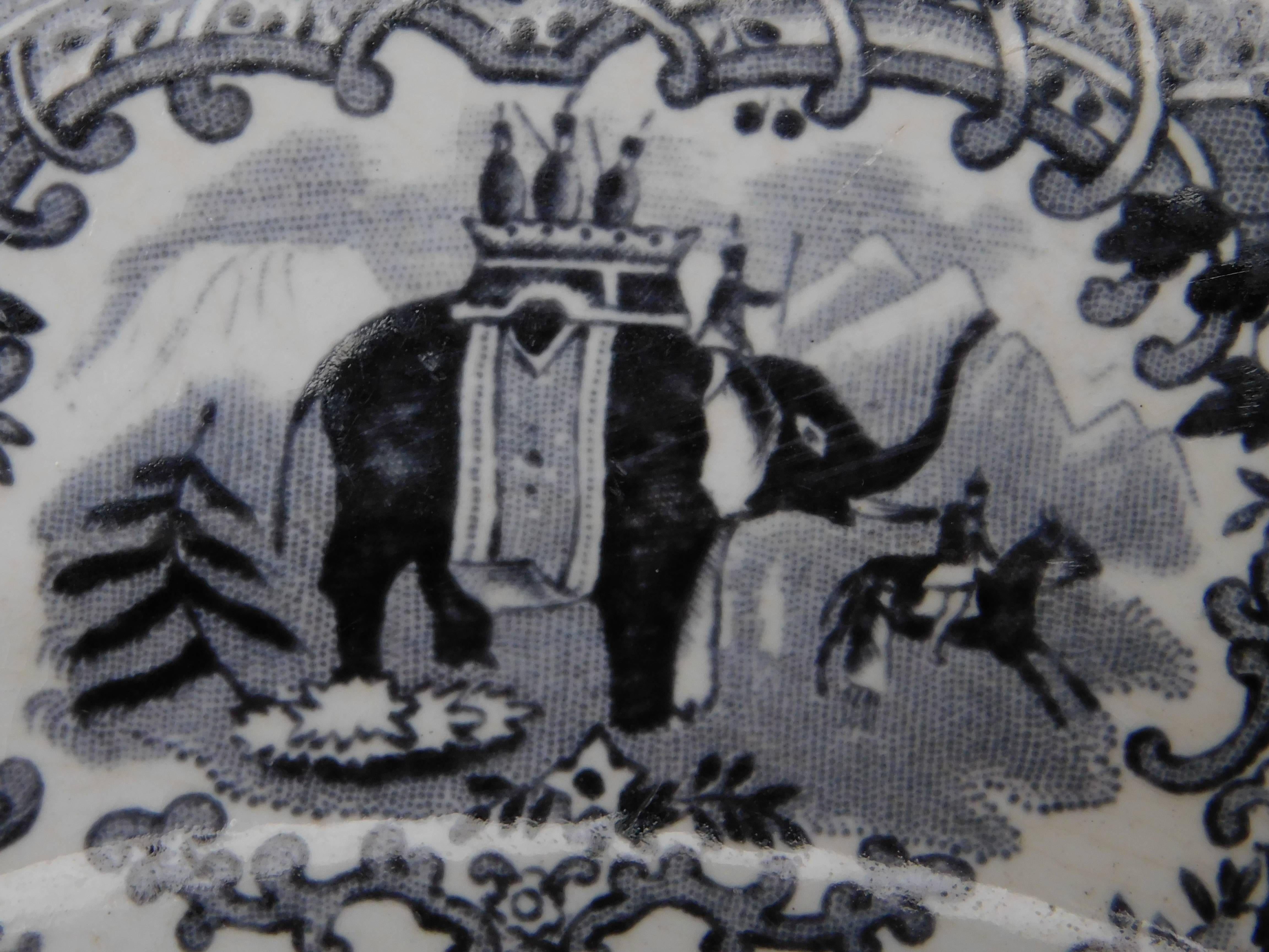 A pair of black and white Dutch transfer decorated plates depicting Hanibal's elephant army. Made at the turn of the 19th century by the company Societe ceramique in Maastricht.