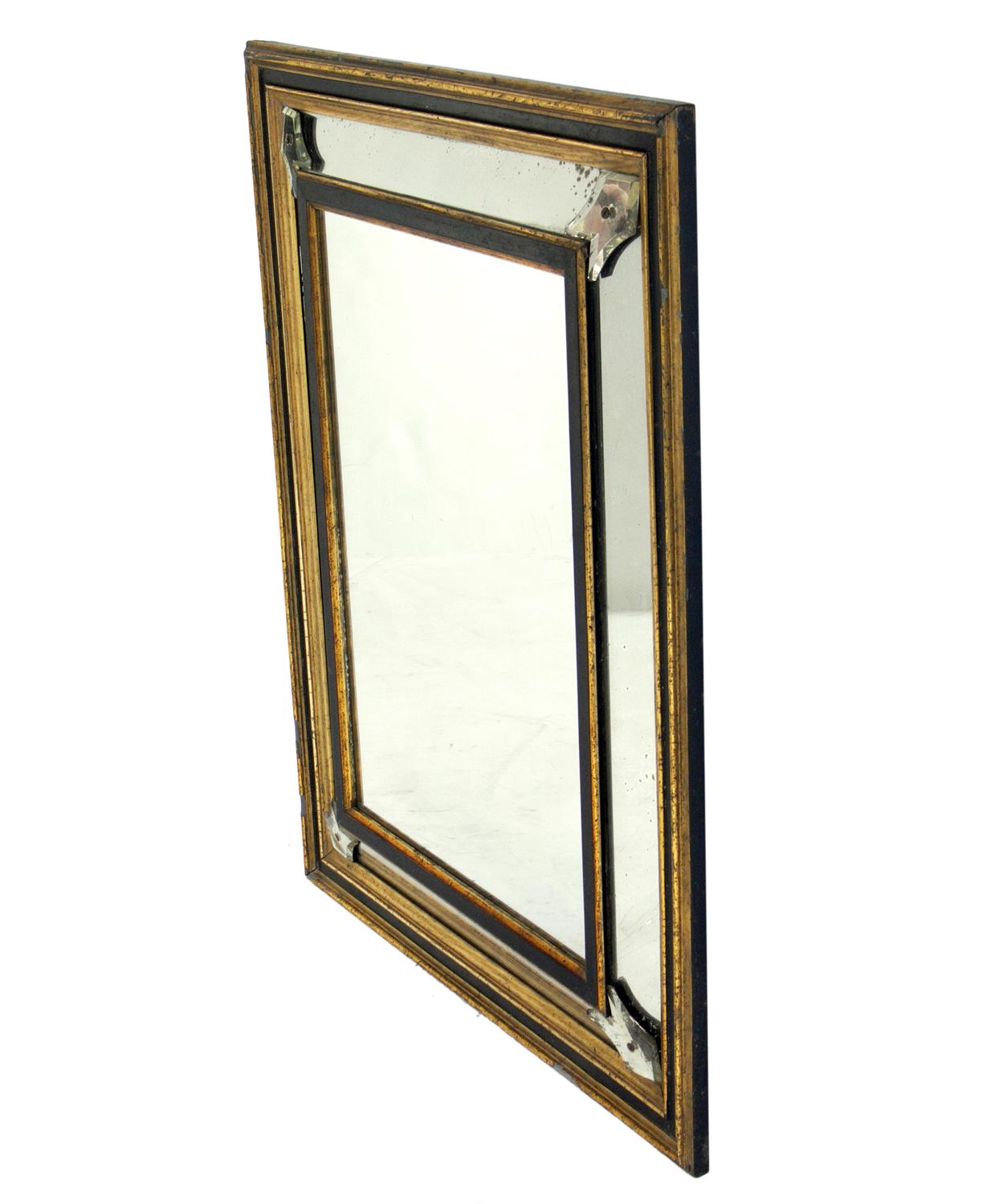 19th century black and gold gilt mirror, American, circa 1890s. Retains wonderful distressed patina and age spotting to the mirrored, black, and gilt frame. Central mirror probably replaced mid-20th century.