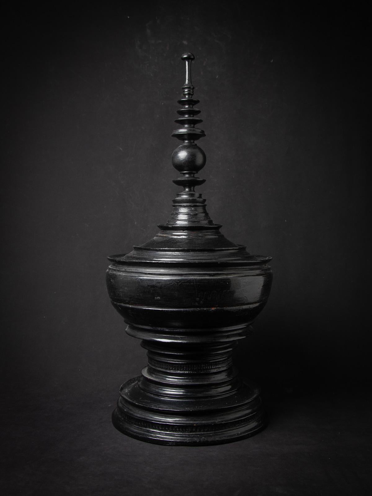 This Black antique Burmese offering vessel is a remarkable piece of Southeast Asian craftsmanship, showcasing the rich heritage of Shan (Tai Yai) style lacquerware. Measuring 80 cm in height and 36 cm in diameter, this 19th-century vessel is