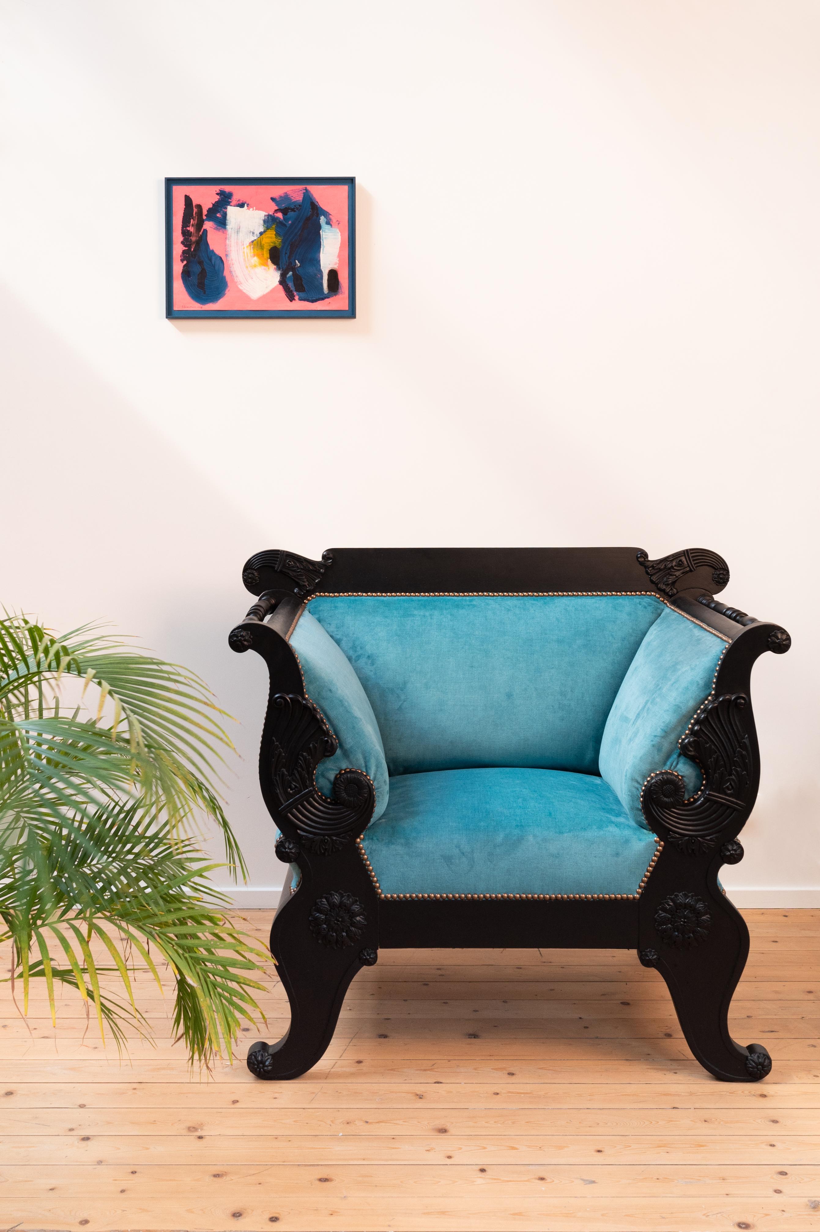 Original massive Biedermeier chair, which was painted black and given a new blue velours upholstery to give it a modern look. 

The fabric used is knitted velours, called Moss 33 (by Keymer). Knitted velours implies that the fabric has a rich colour