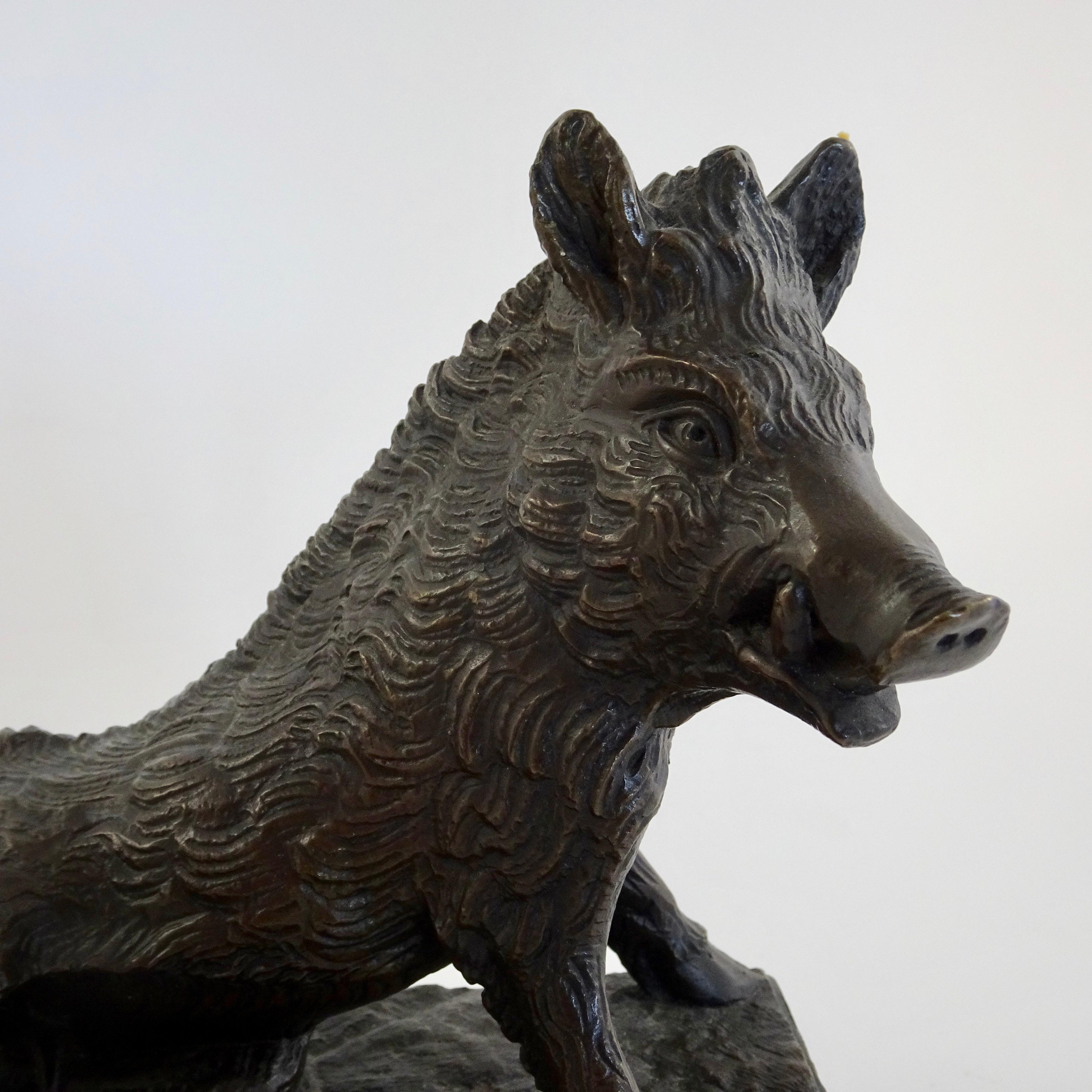 19th century black bronze boar figurine sculpted by Joseph Victor Chemin. Joseph Victor Chemin was born in Paris in 1825 and was one of Antoine Louis Barye's successful students. He first exhibited at the Salon of 1851. His bronzes were of domestic