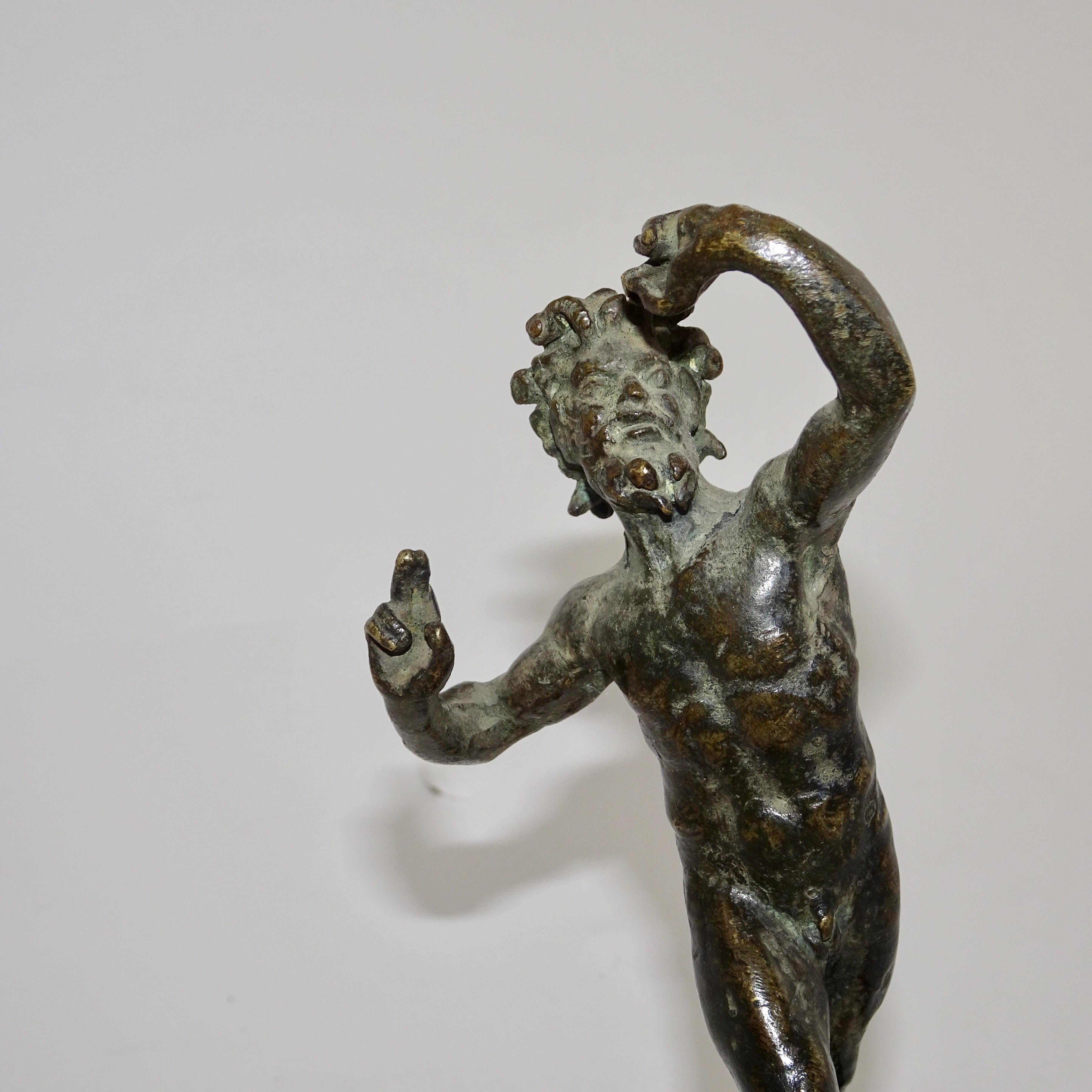 19th century black bronze statuette of Biblical Man on black base. The arm and hand placement of the man is historically representative of Jesus.