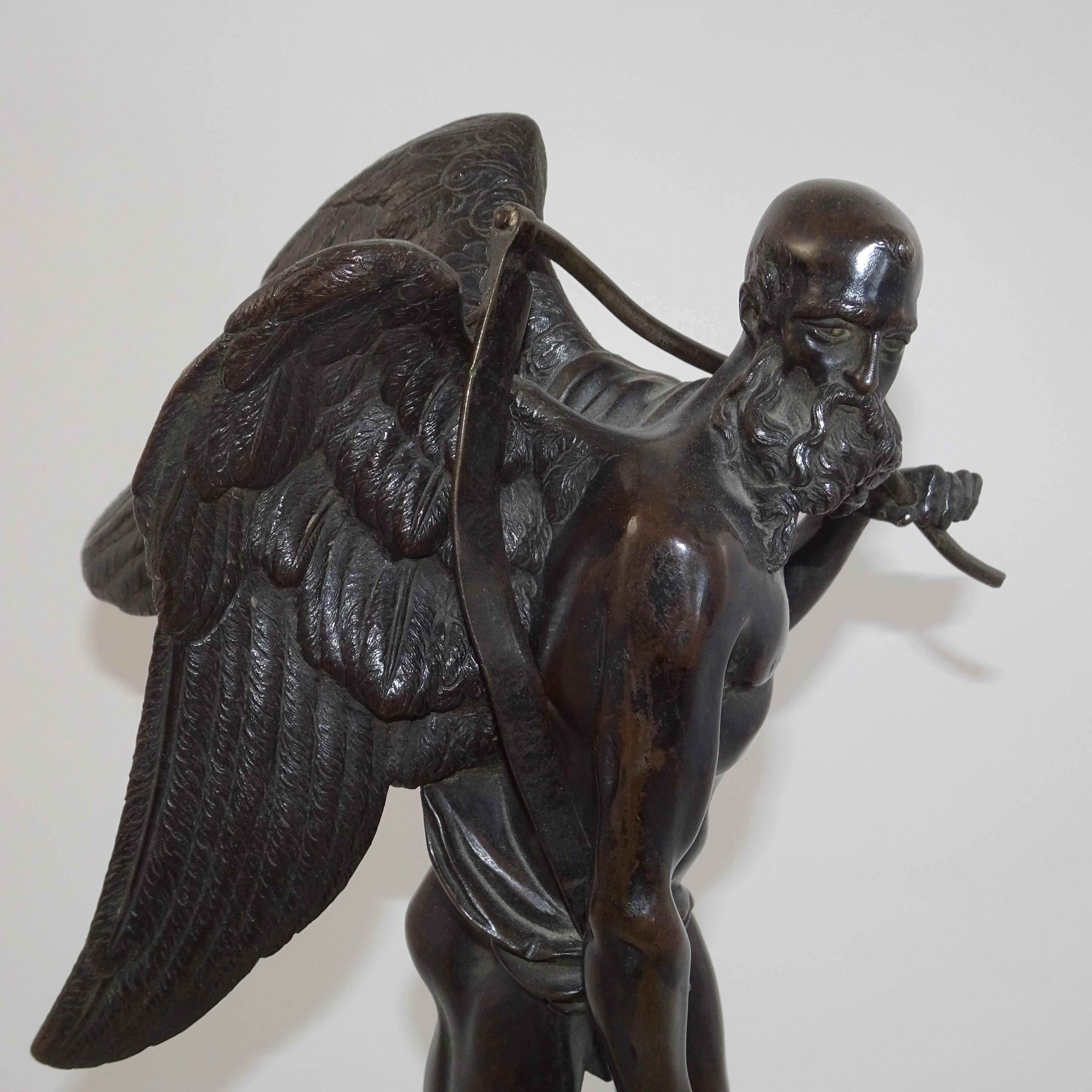 19th century black bronze statuette of winged old man on black base. This statuette depicts the biblical angel from Revelations 14 in which the Bible says 