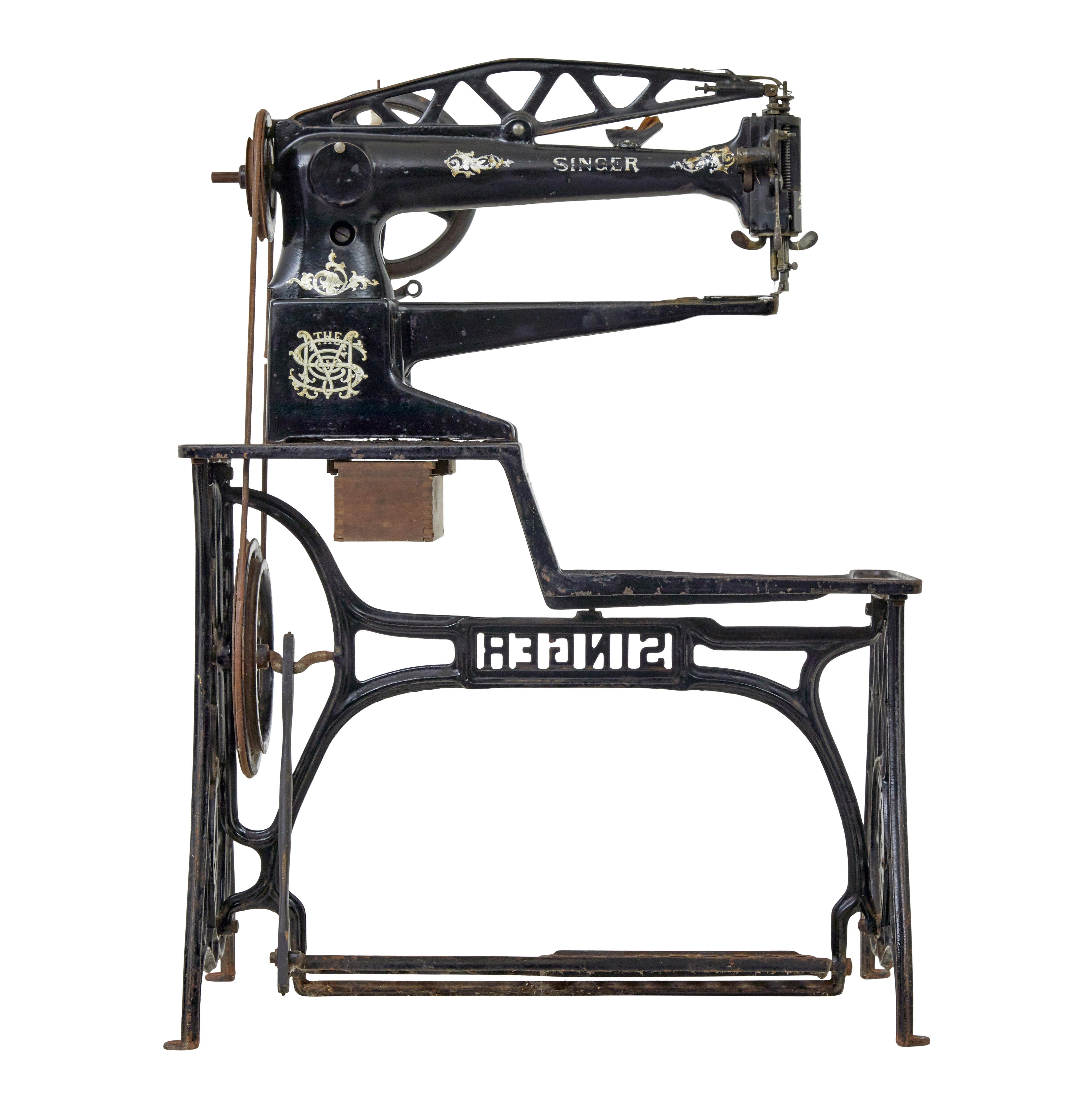 máquina de coser singer del siglo xix de la fábrica de hierro fundido negro Victoriano