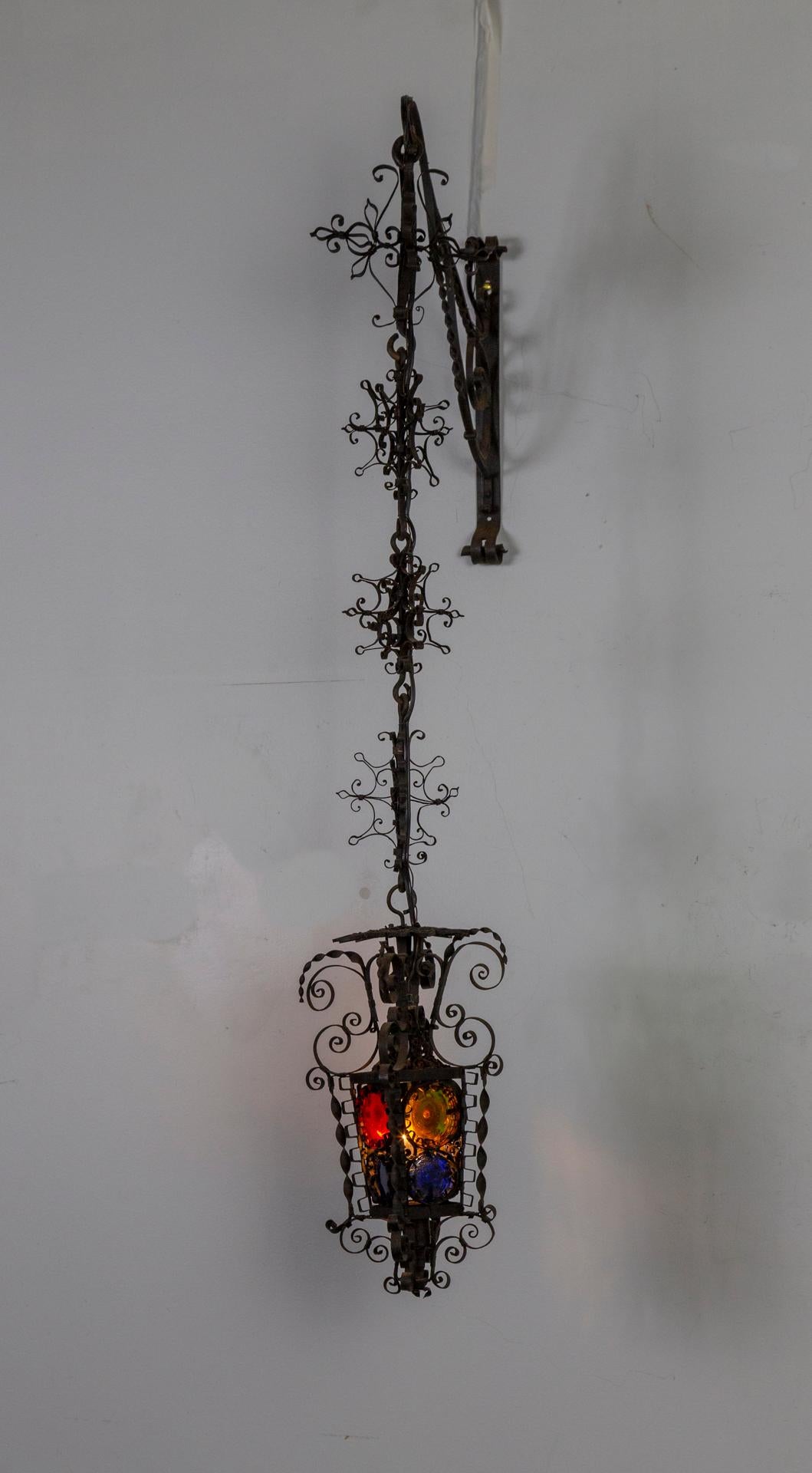 Italian 19th Century Black Filigree Iron Hanging Wall Lantern W/ Colored Glass For Sale