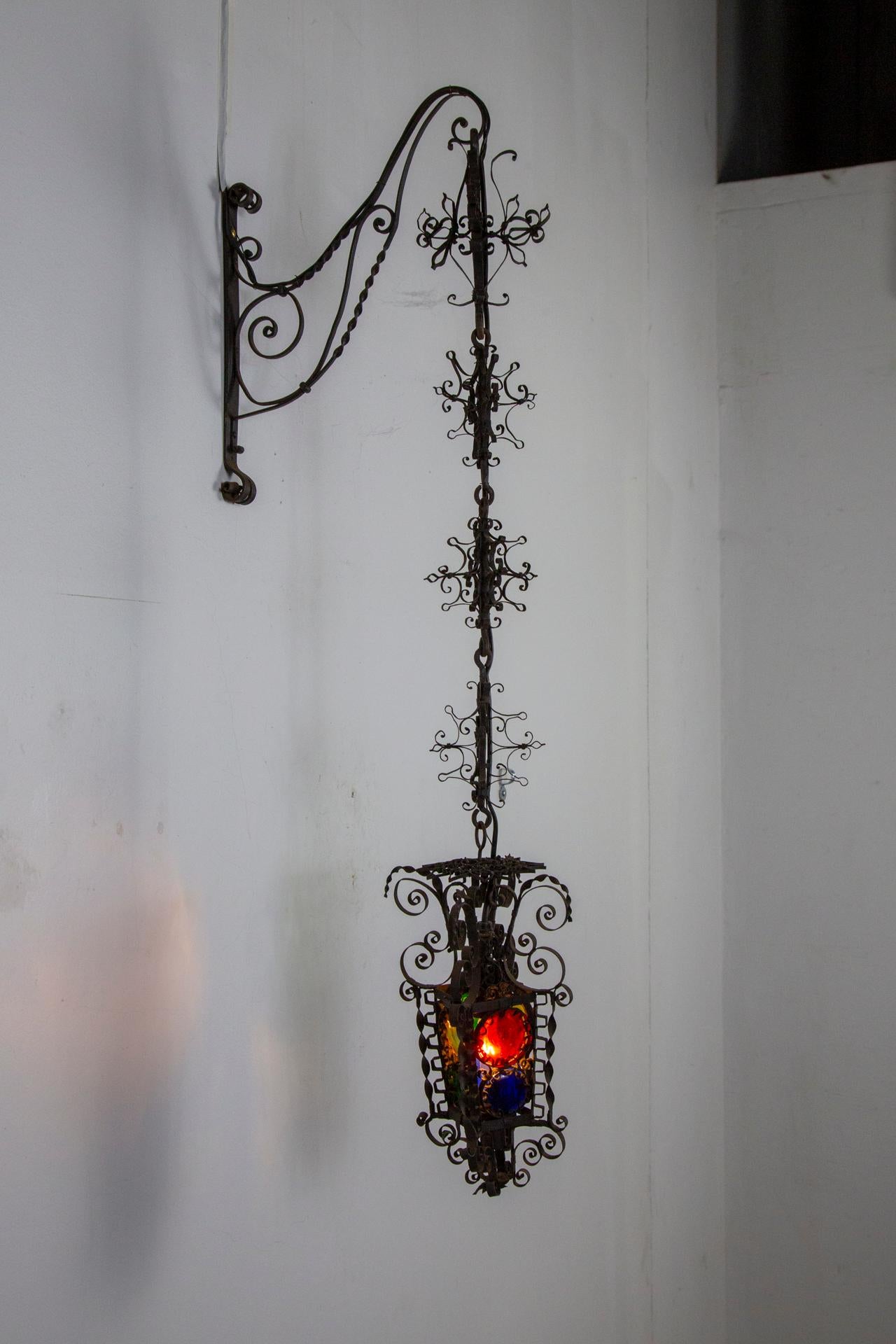 19th Century Black Filigree Iron Hanging Wall Lantern W/ Colored Glass For Sale 1
