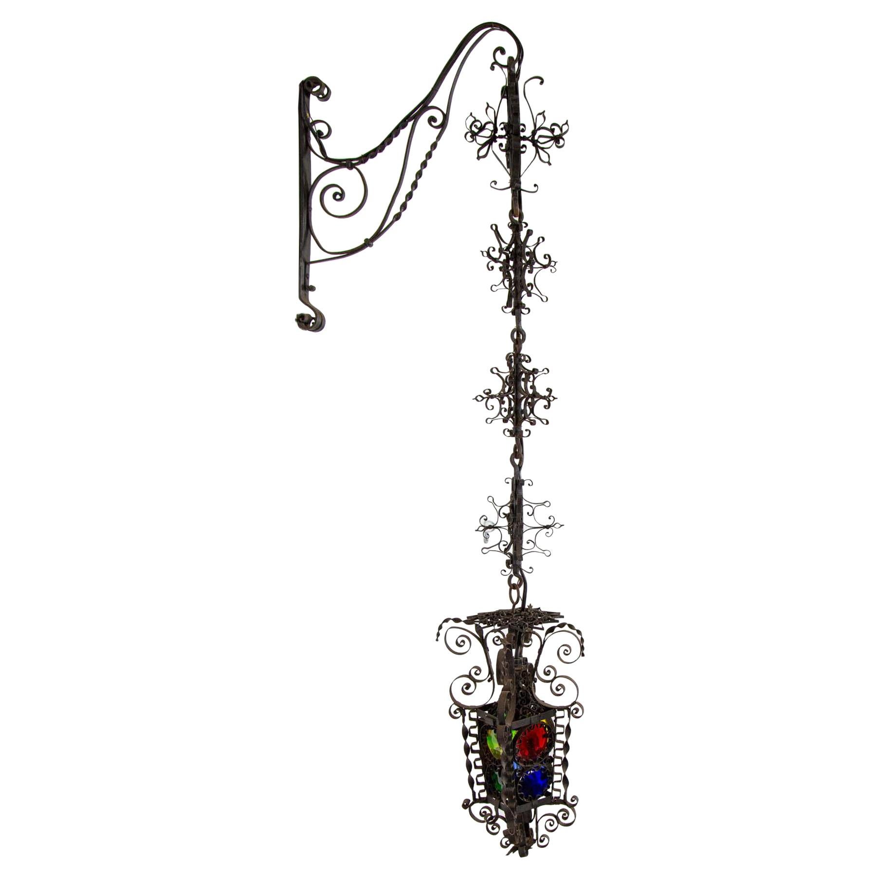 19th Century Black Filigree Iron Hanging Wall Lantern W/ Colored Glass For Sale