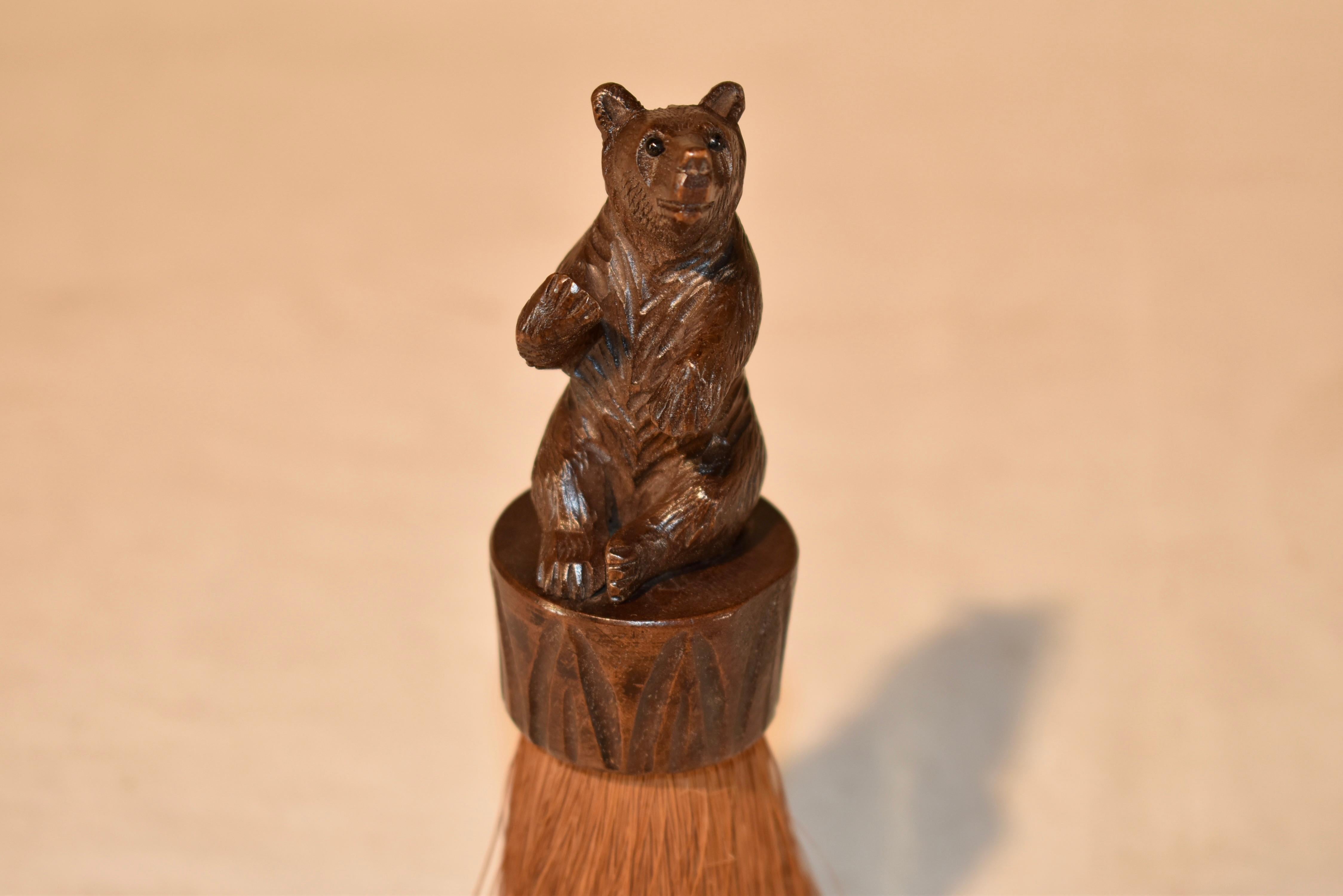 Late 19th century hand carved bear brush from Switzerland.  The bear is expertly hand carved and has a very whimsical look.  Such an adorable souvenir, these were small tokens travelers picked up on the Grand Tour of Europe in the late Victorian