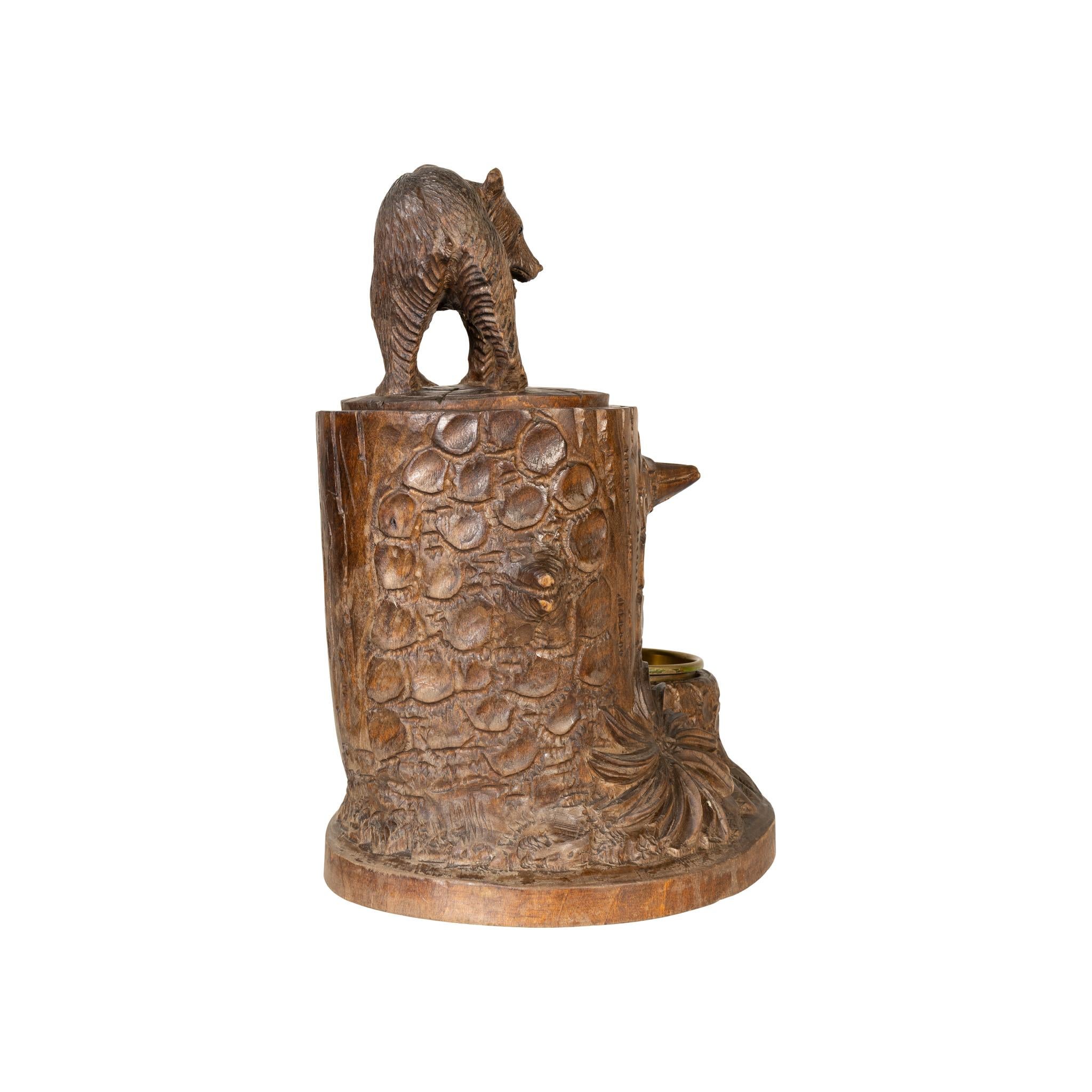 Black Forest humidor. Tree trunk style with standing bear on top. Brass ashtray and match holder.

The idea behind the marvelous success of Brienz wood carving was quite simple. After a disastrous famine in 1816 in the Brienz area people were forced