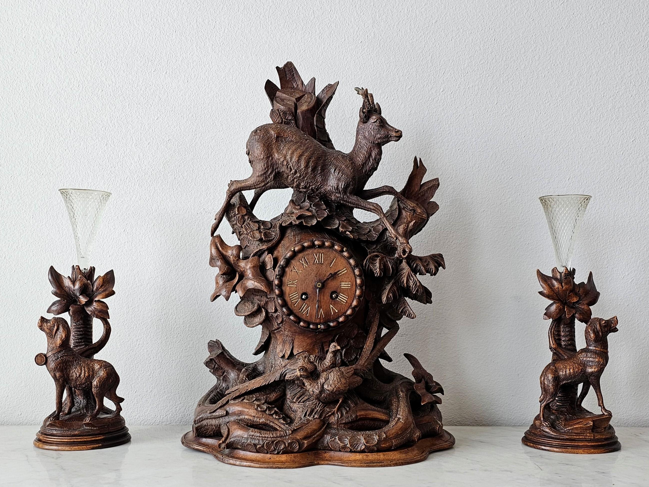 A magnificent antique Black Forest carved three piece mantel clock and garniture set. circa 1880

Swiss or German, late 19th century, a truly extraordinary work of art, exceptionally executed, intricately sculpted and finely detailed throughout,