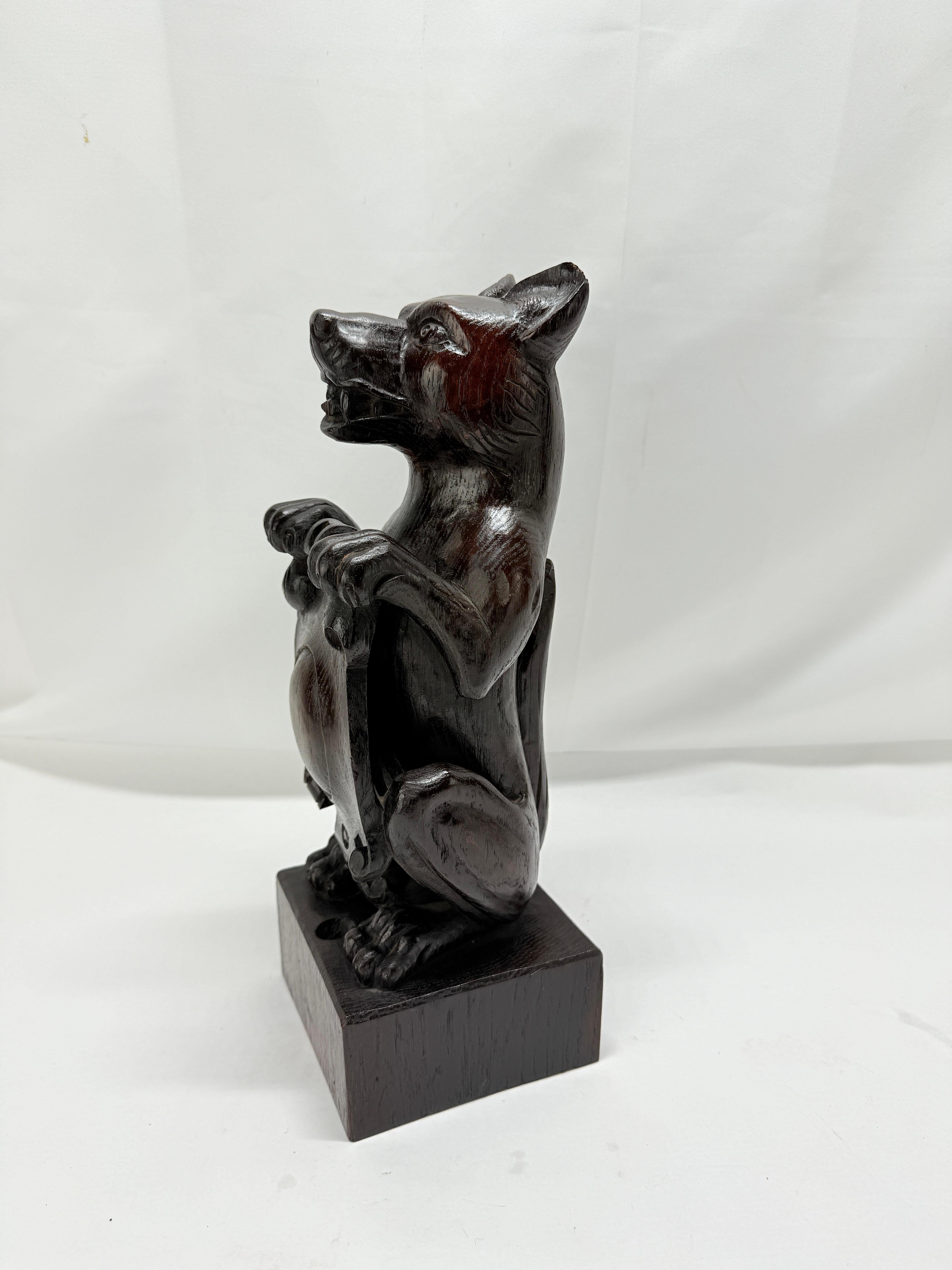 Swiss 19th Century, Black Forest Carved Oak Newel Post Finial Form of a Dog w/ Shield For Sale