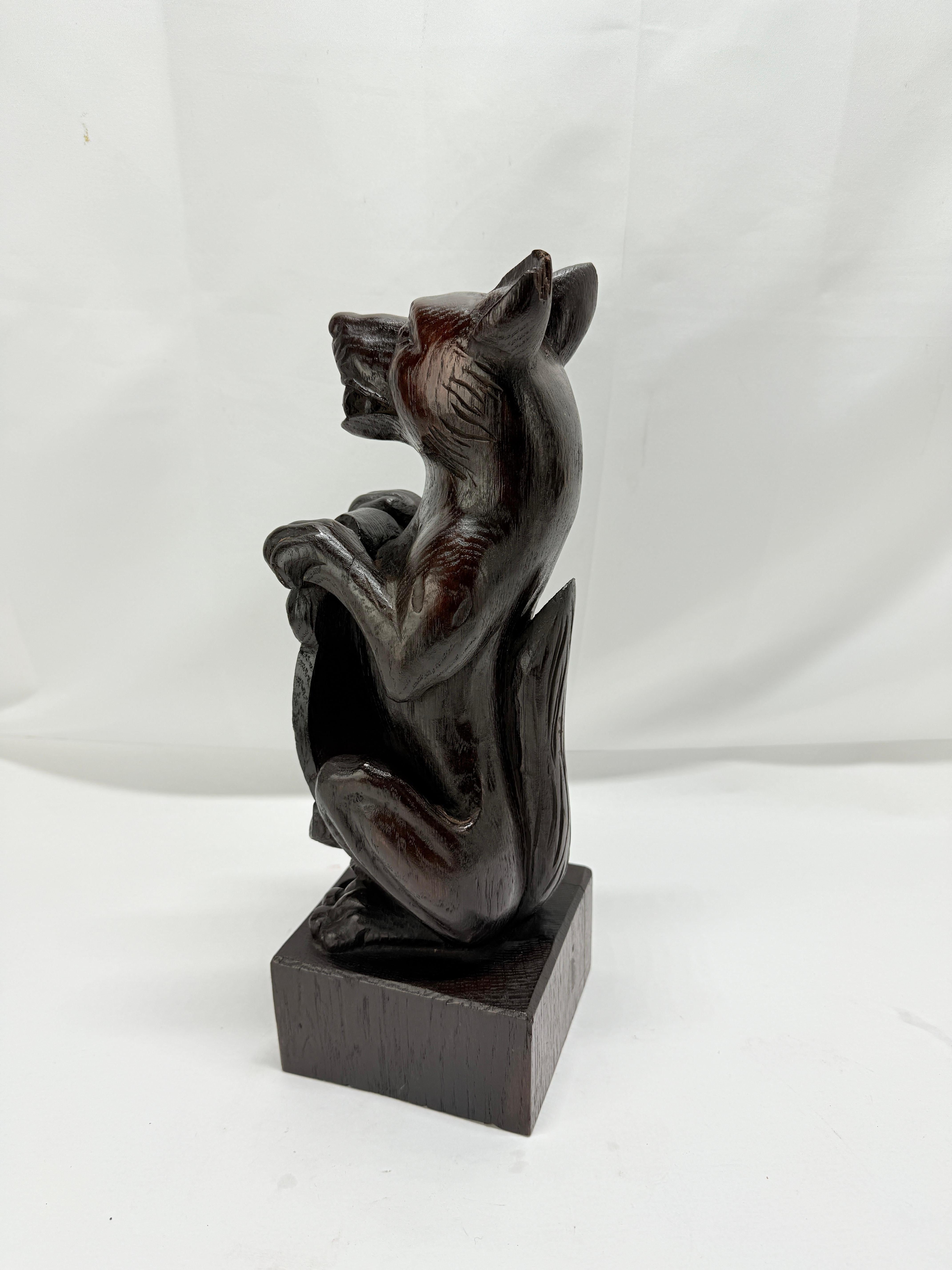 19th Century, Black Forest Carved Oak Newel Post Finial Form of a Dog w/ Shield In Good Condition For Sale In Atlanta, GA