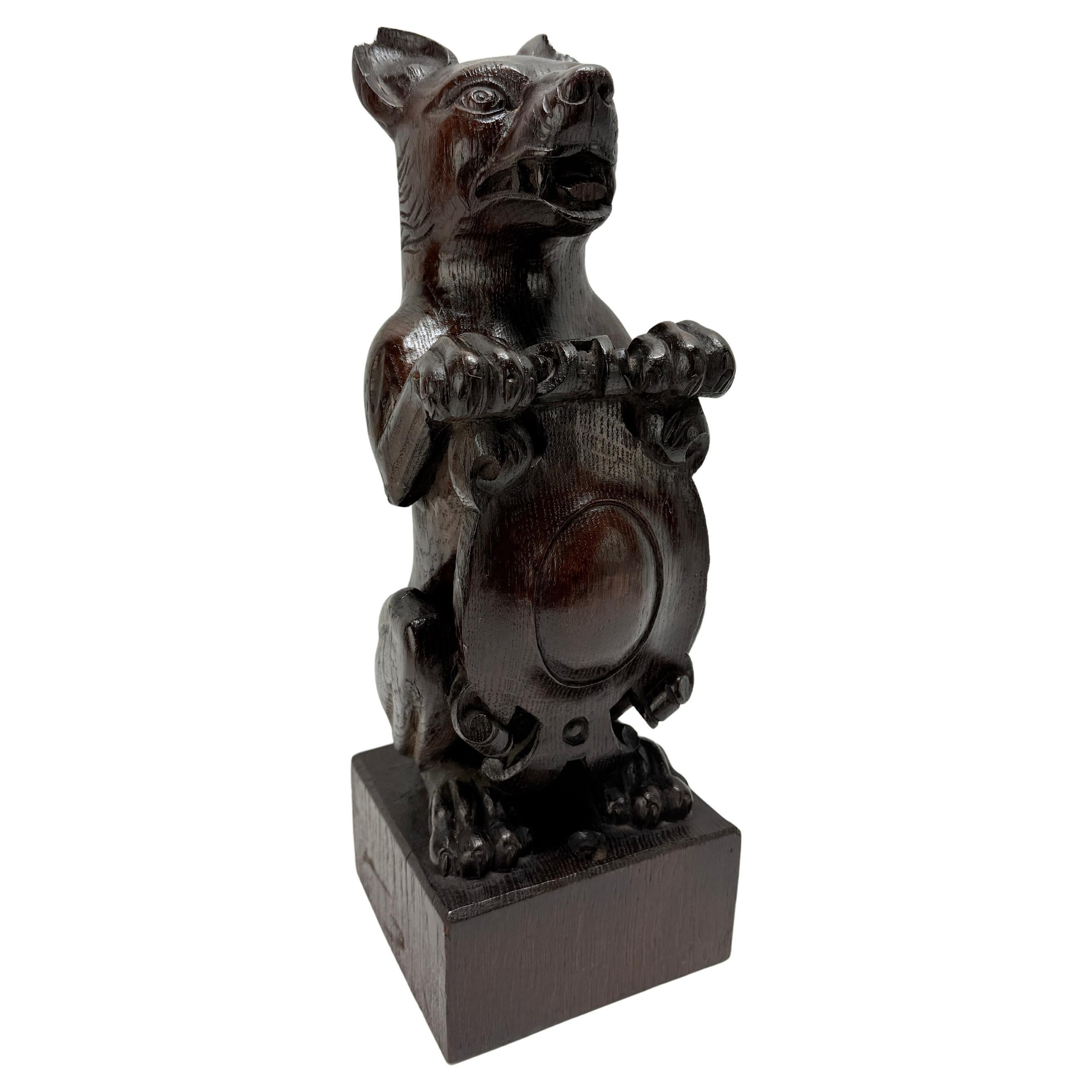 19th Century, Black Forest Carved Oak Newel Post Finial Form of a Dog w/ Shield For Sale