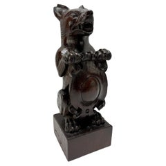 19th Century, Black Forest Carved Oak Newel Post Finial Form of a Dog w/ Shield