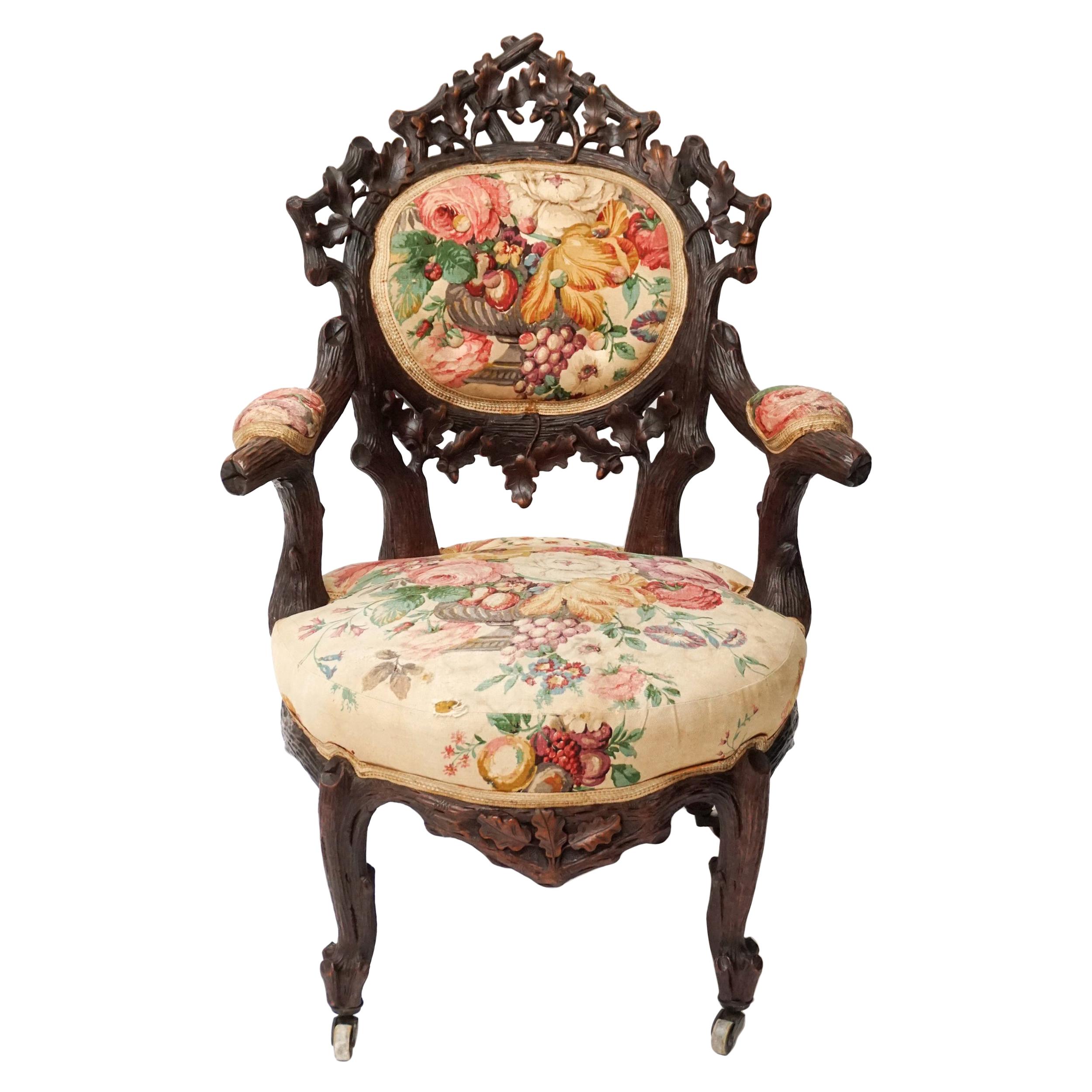 19th Century Swiss Black Forest Carved Walnut and Fabric Upholstered Armchair For Sale