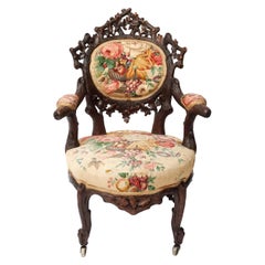 19th Century Swiss Black Forest Carved Walnut and Fabric Upholstered Armchair