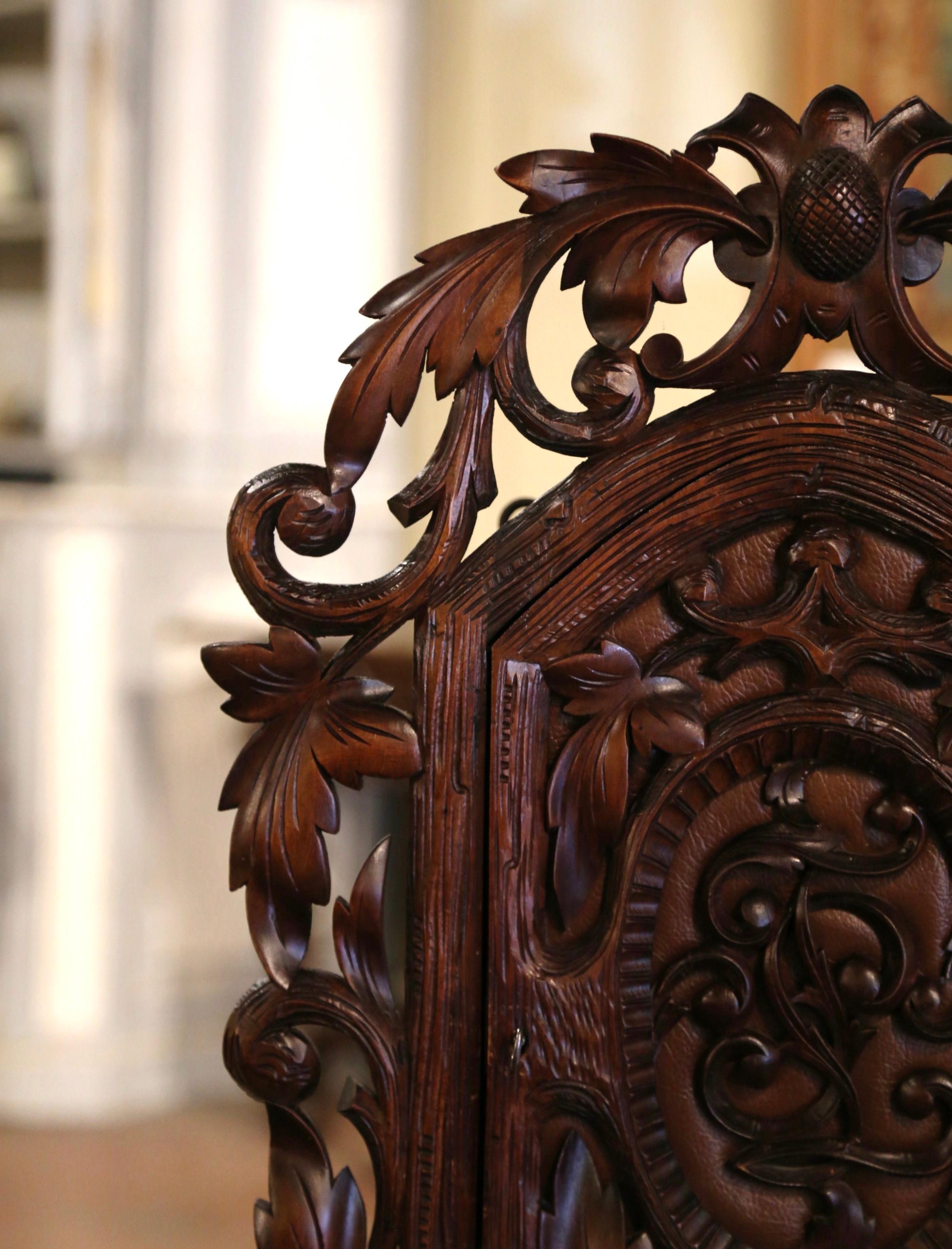 Hand-Carved 19th Century Black Forest Carved Walnut and Leather Wall Vitrine Cabinet  For Sale