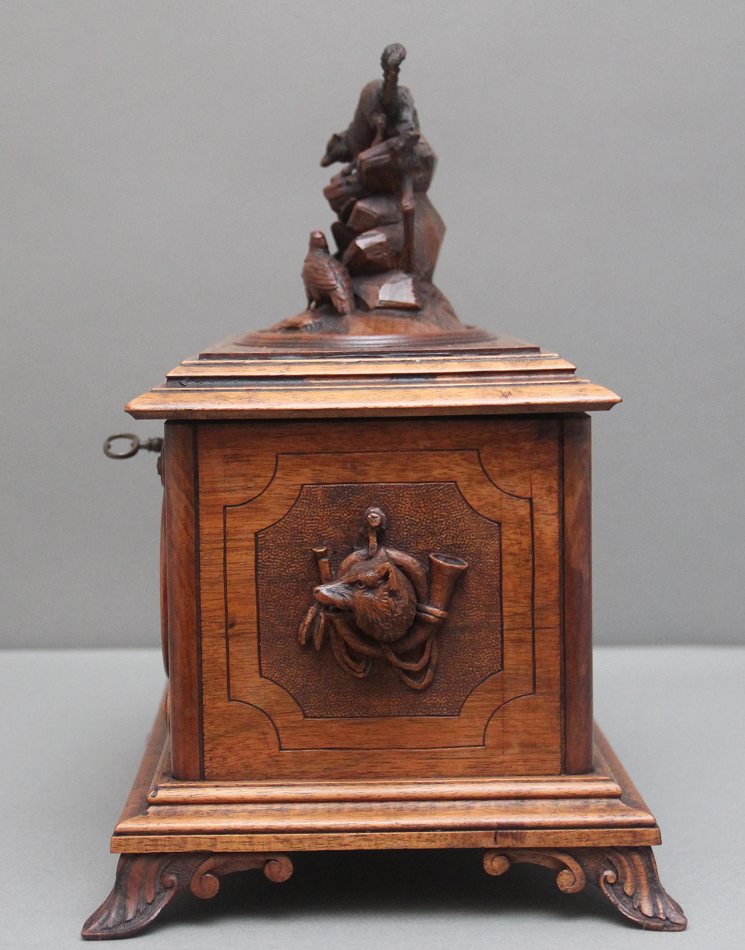 Walnut 19th Century black forest carved wood casket For Sale
