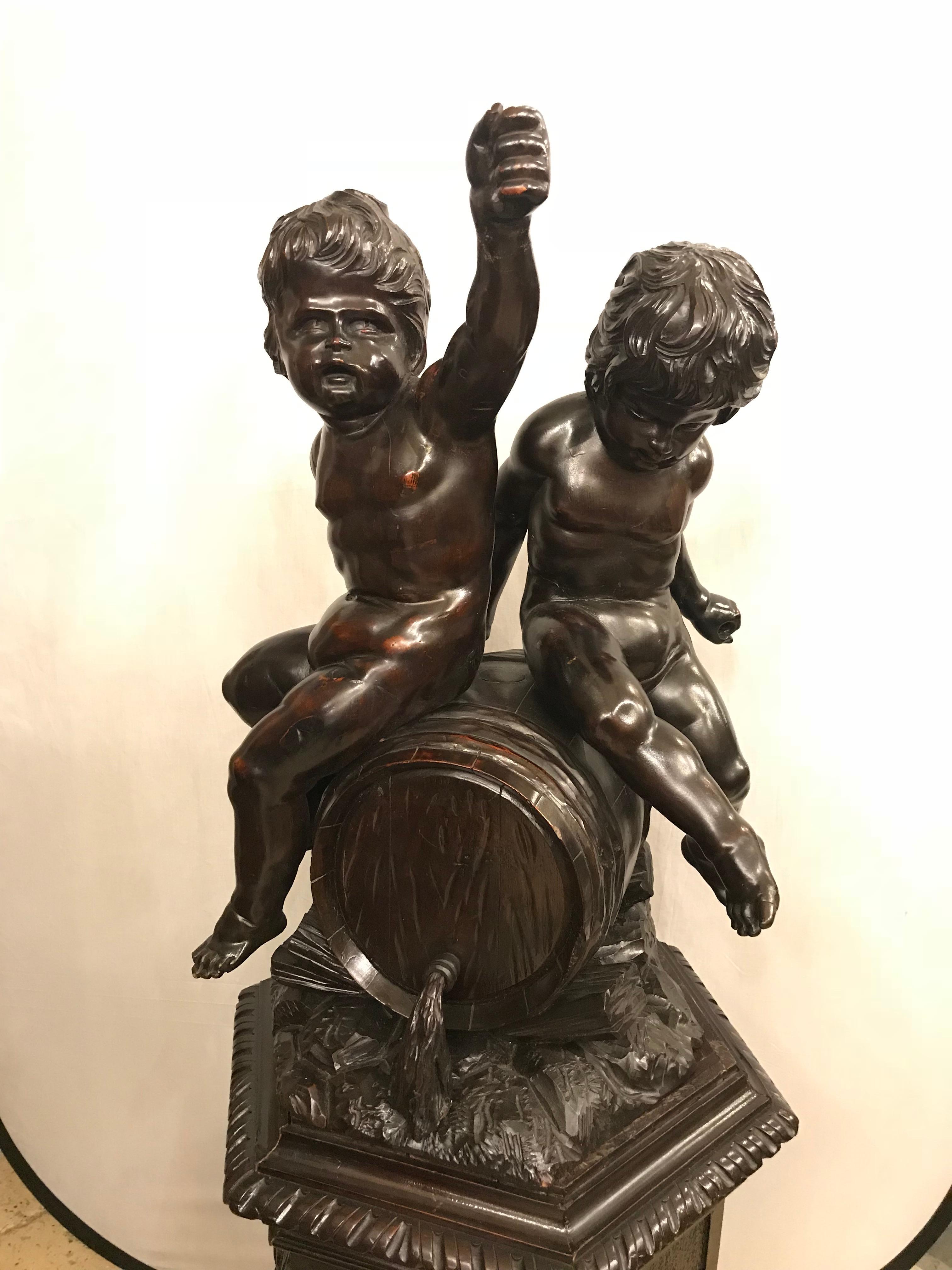 A spectacular large and very impressive one of a kind 19th century Black Forest carving on pedestal of two babies. A finely carved pedestal supporting a beer barrel having two drunken naked cherubs celebrating. Simply the finest of carvings.

PXAX