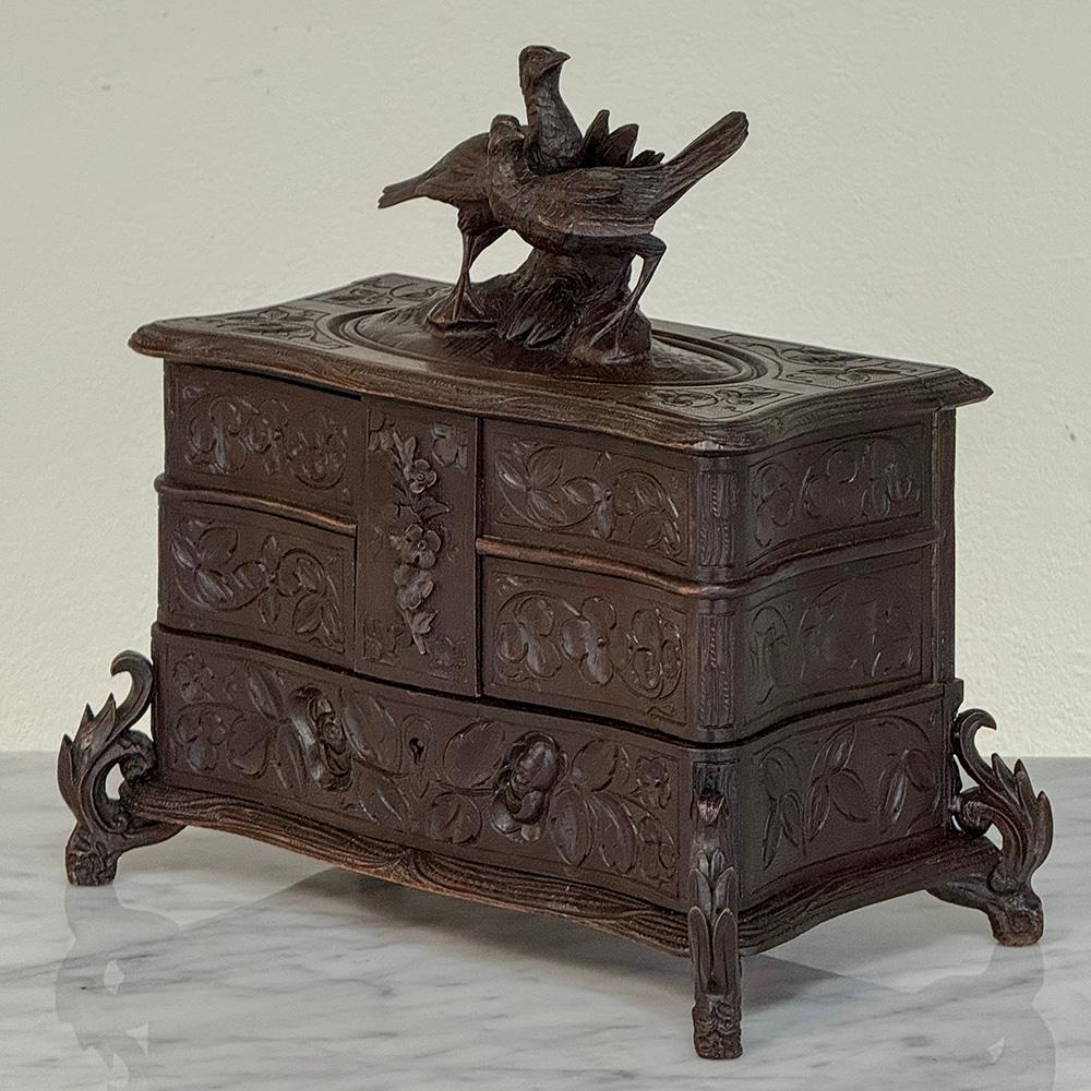 19th Century Black Forest Hand-Carved Jewelry Box is a true testament to the sculptor that created such a magical work of art!  One immediately notices the pair of love birds on the top, rendered in full three dimensions and designed to appreciate