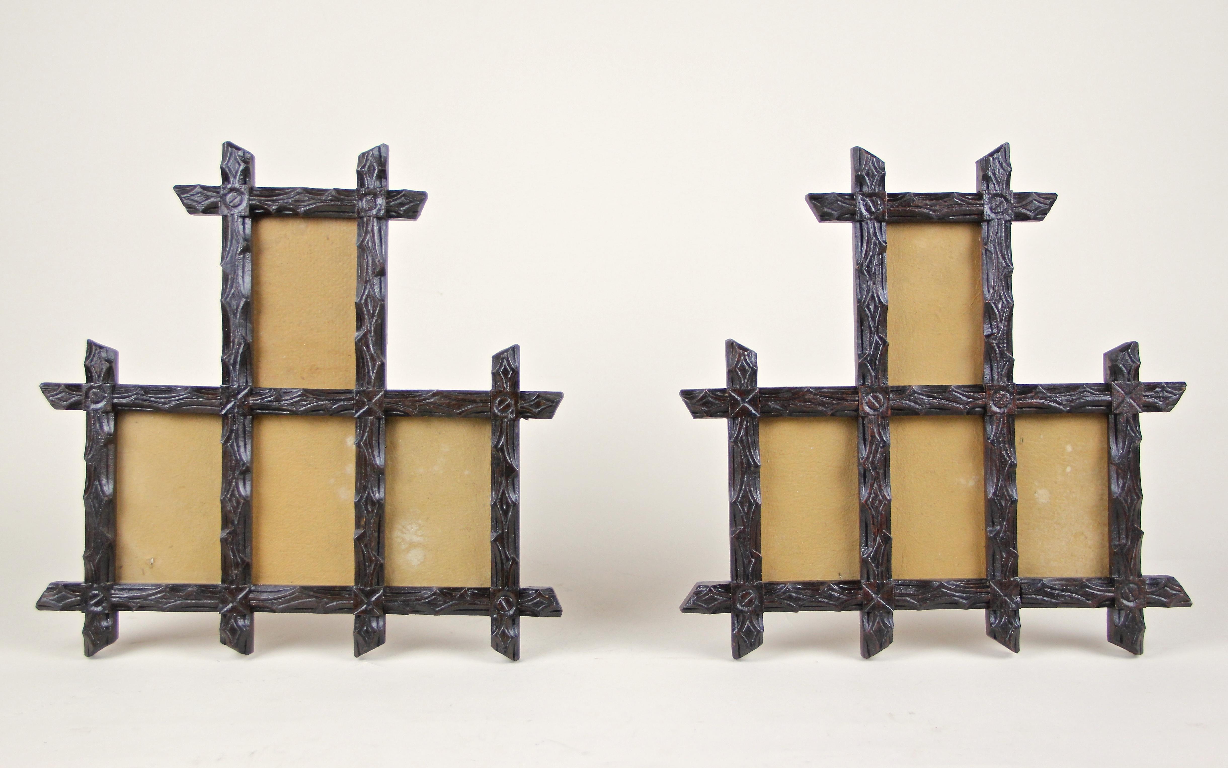 Rustic set of two 19th century Black Forest photo frames out of Austria, circa 1880. Artfully hand carved out of basswood, this frame shows a fantastic design combined with beautiful protruding corners. This set of very decorative Black Forest