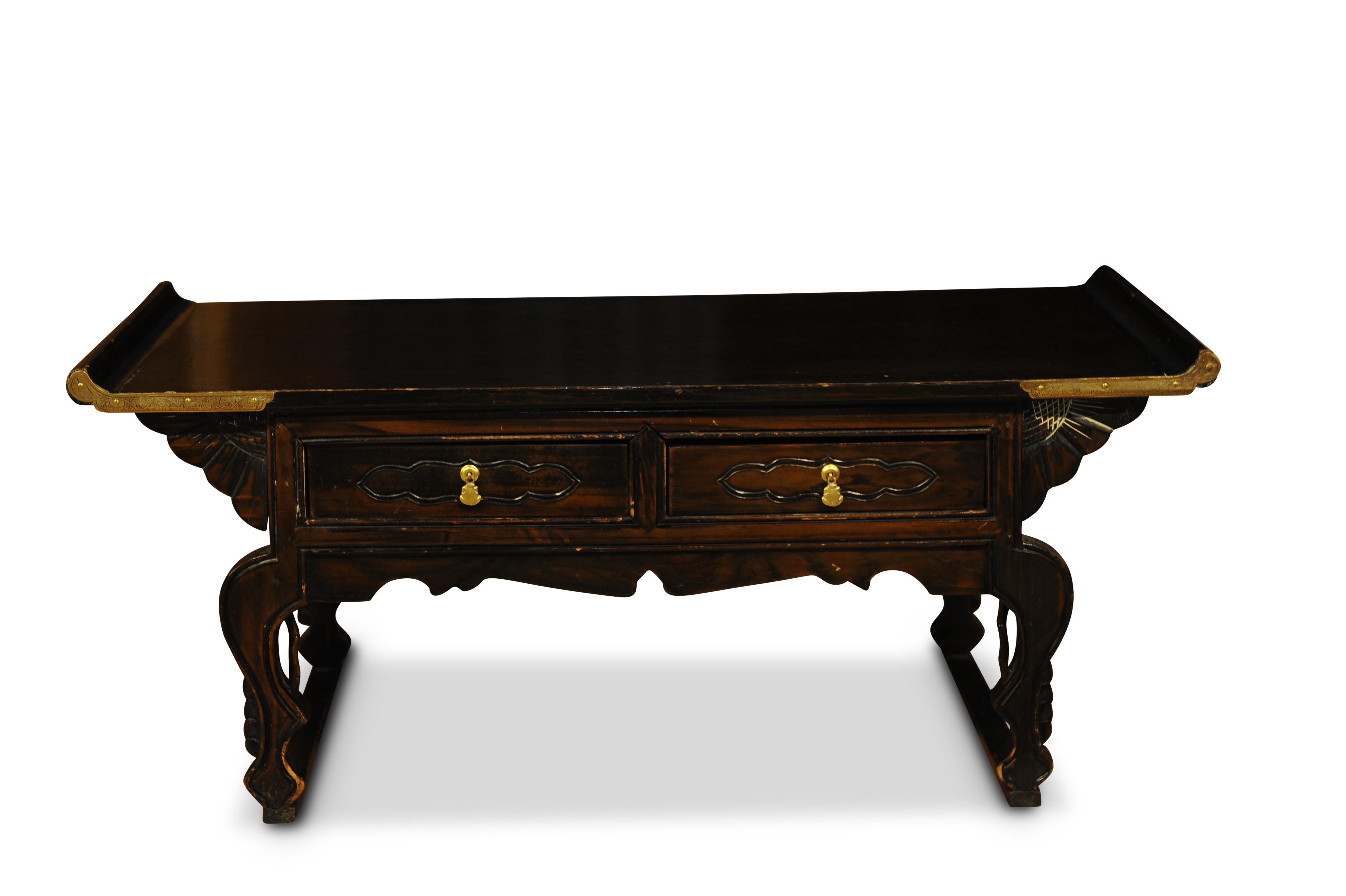 Victorian 19th century symmetrical black lacquered low Chinese export altar table with two drawers.

The piece has been left unrestored and remains in it's original form.