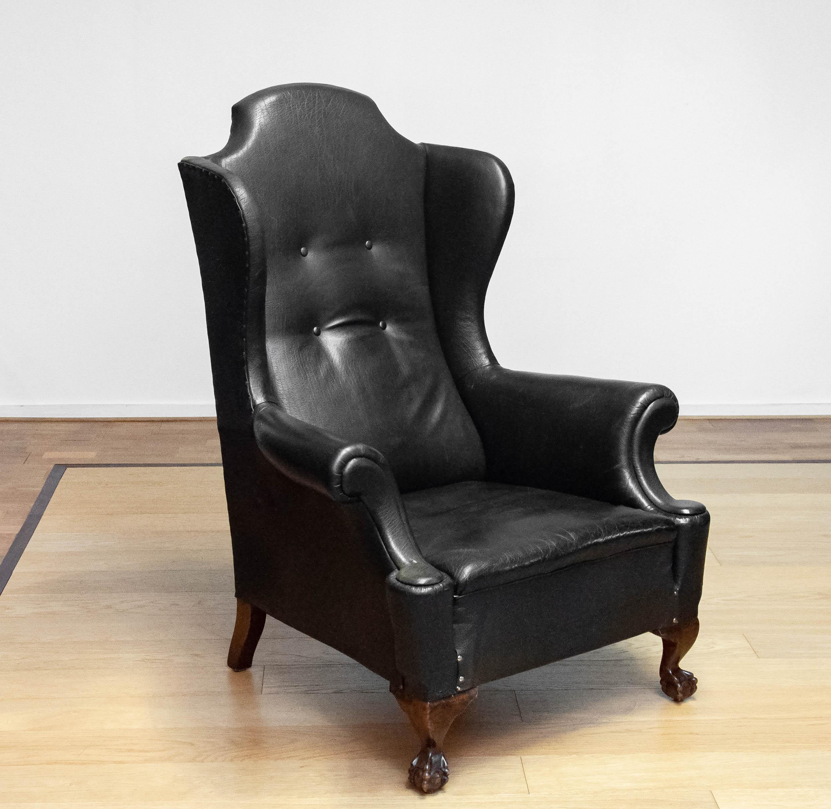 British 19th Century Black Leather Chippendale Wingback Chair With Claw And Ball Feet For Sale