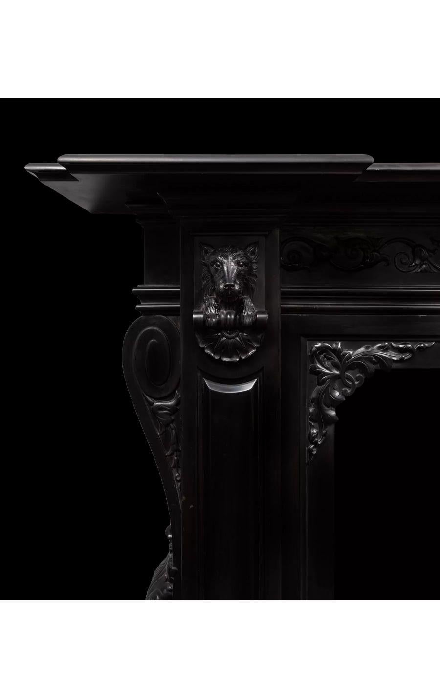19th century black marble fireplace, circa 1860

An exceptional antique highly carved pure black marble fireplace dating to the 1860’s.

The jambs with scrolled acanthus consoles on the sides, raised and fielded panelled pilasters under carved
